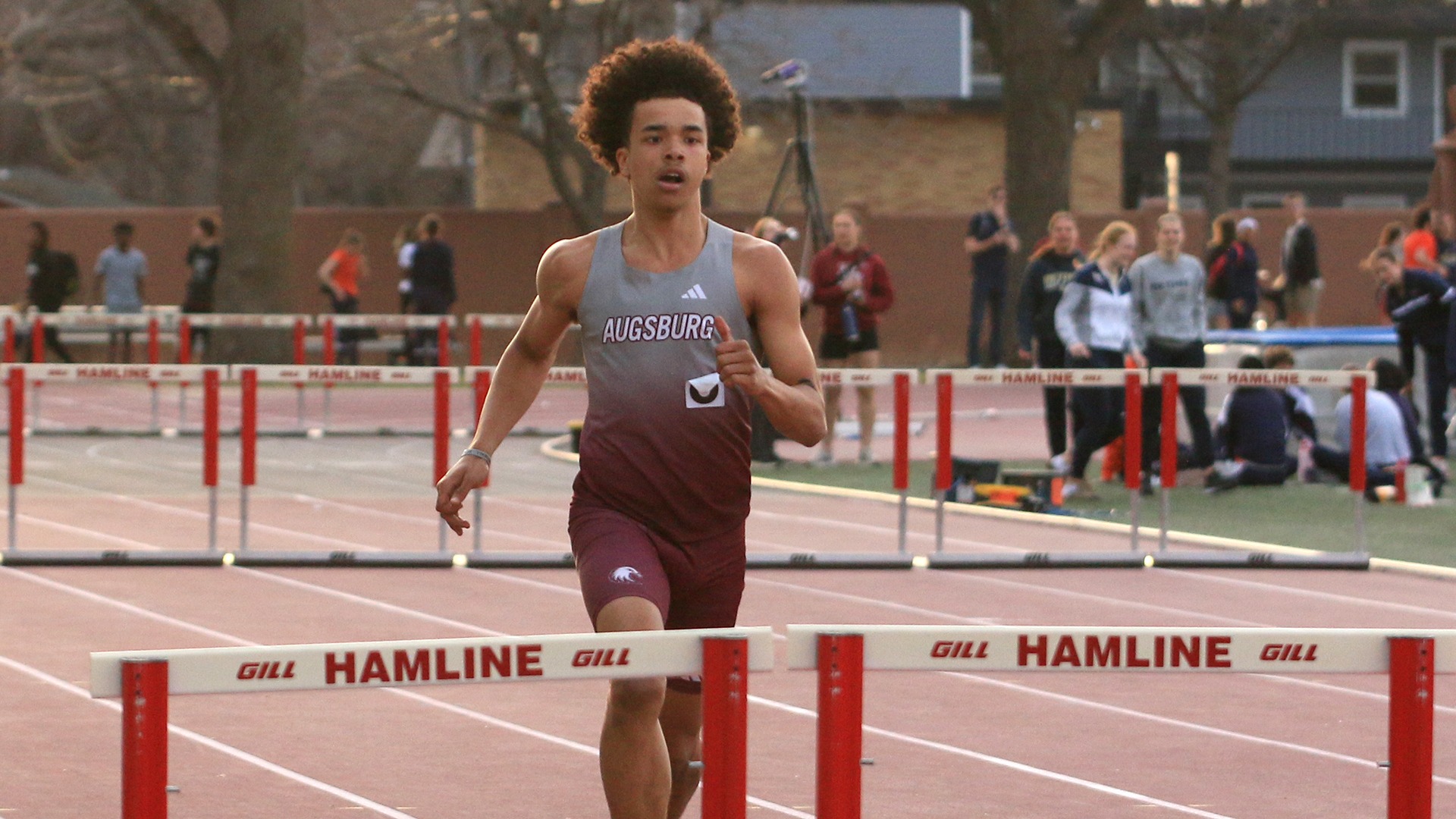 Jamir Horton runs in a hurdles race during a 2026 Augsburg men's track and field meet.
