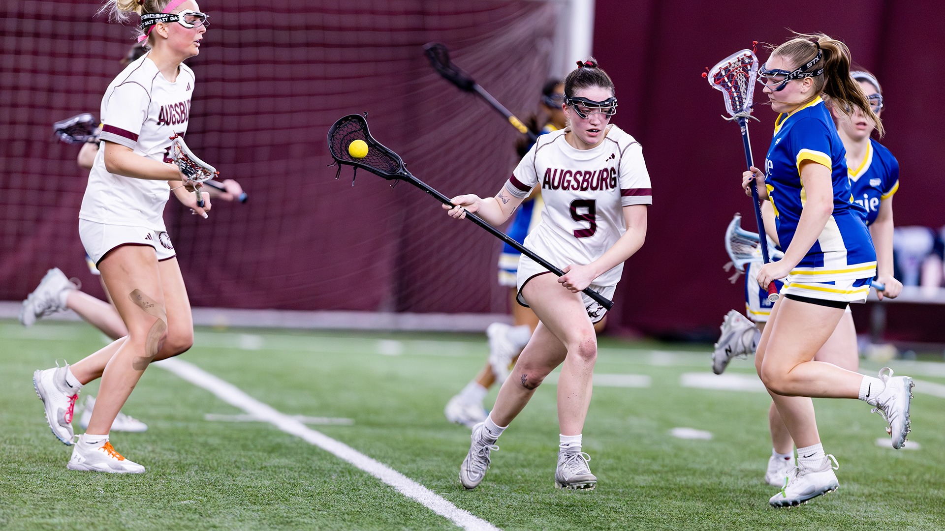 Isabella Kohout handles the ball during a 2026 Augsburg women's lacrosse game.