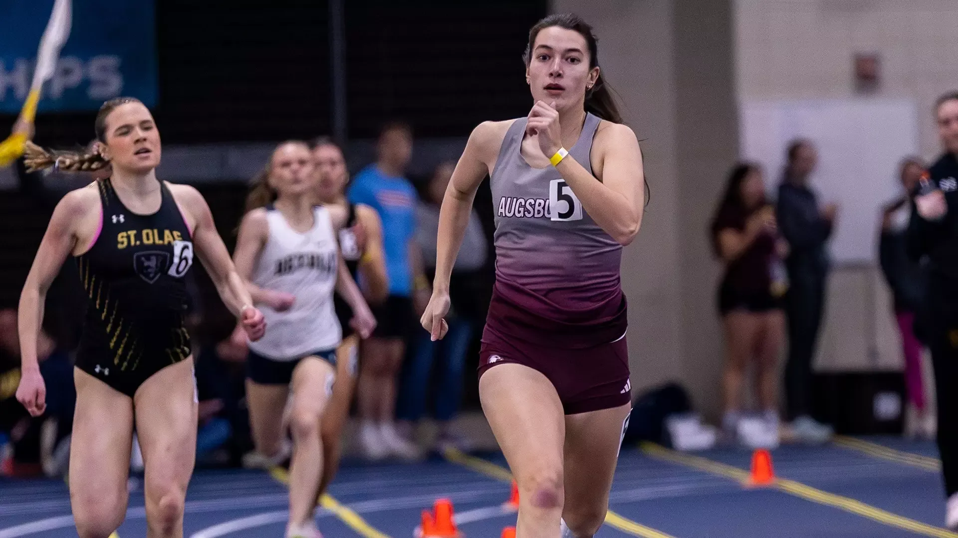 Allison Hookom runs during a 2026 Augsburg women's track and field meet.