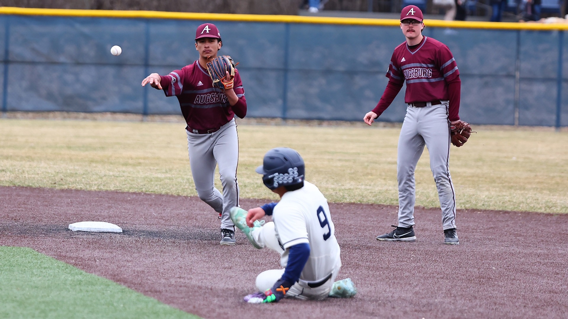 Andruw Vela throws after forcing a runner out at second base during a 2026 Augsburg baseball game.