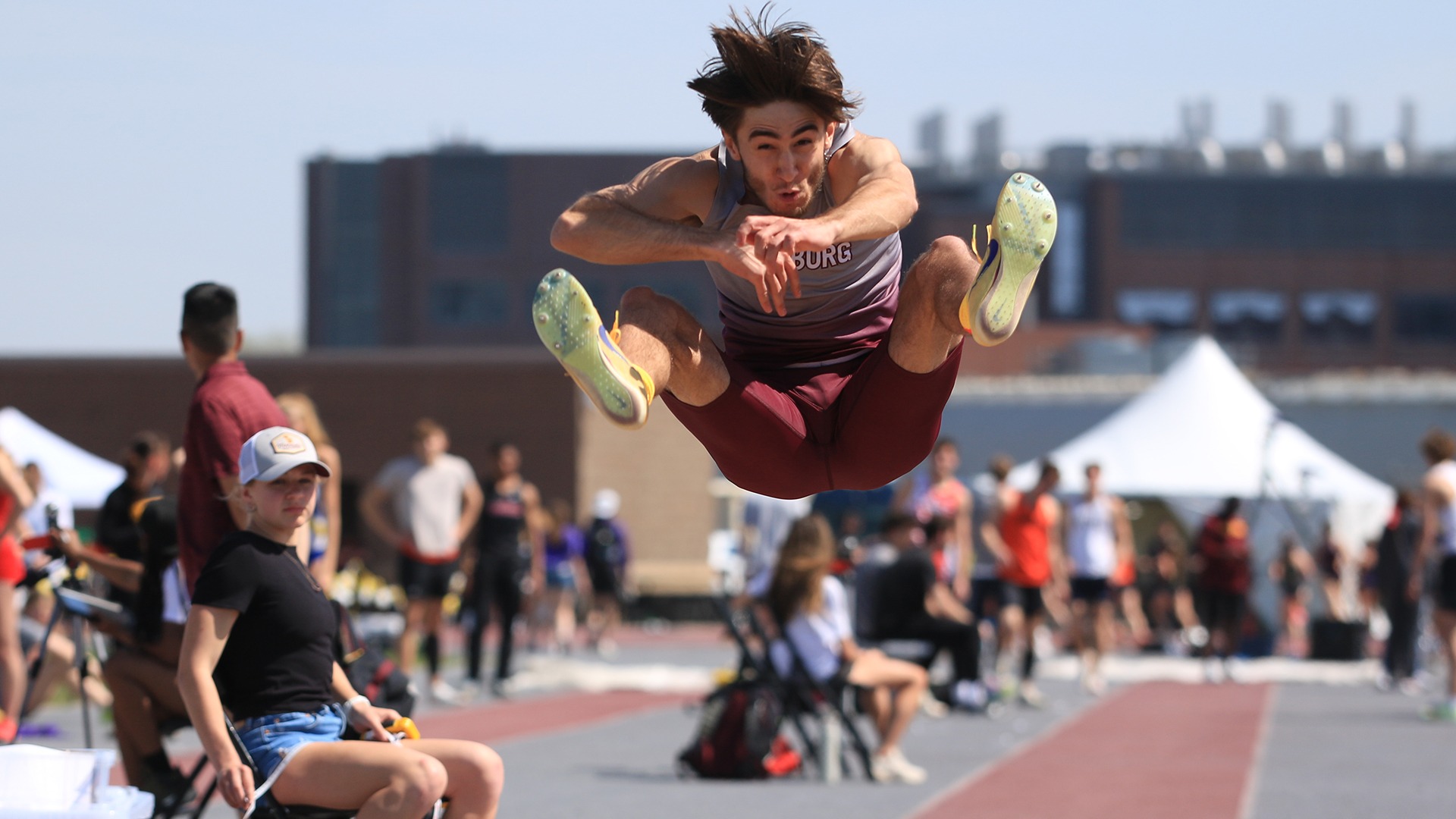 Vicente Bolivar leaps during the long jump at a 2026 Augsburg men's track and field meet.