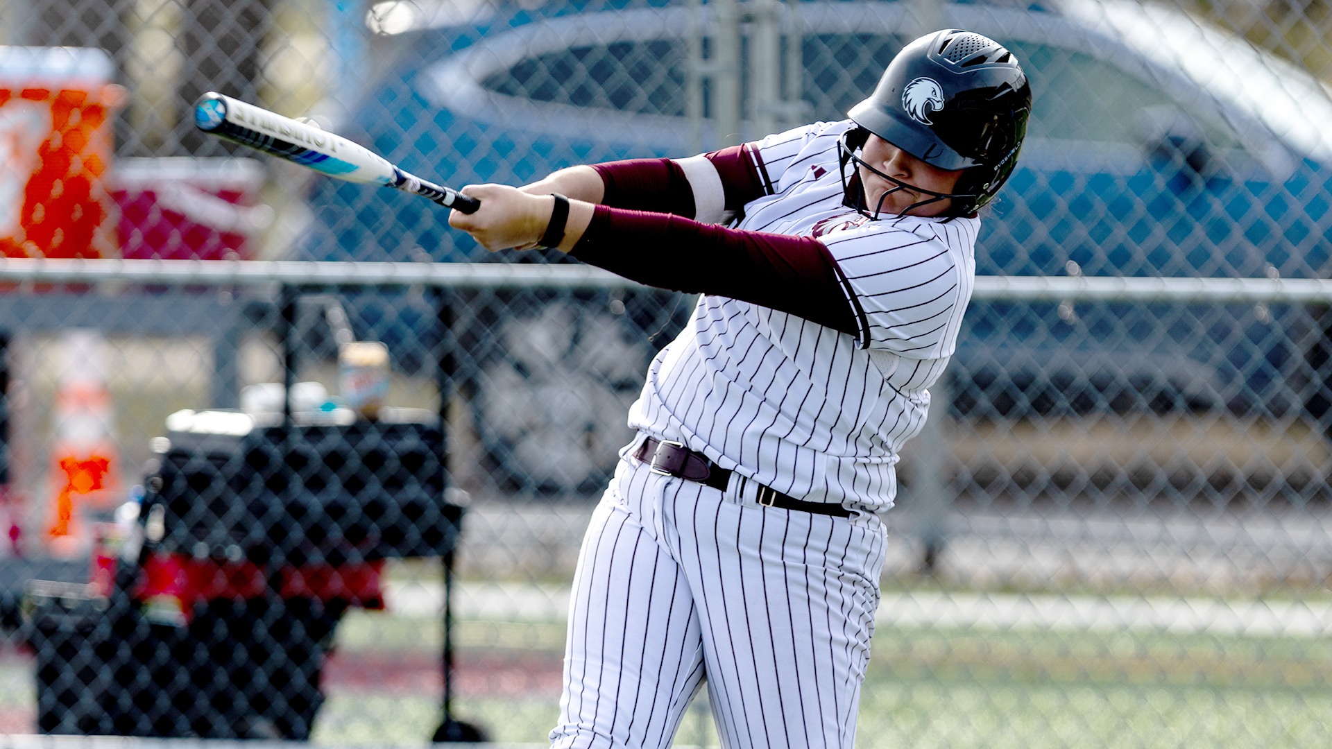 Lola Pilon swings at a pitch during a 2026 Augsburg softball game.