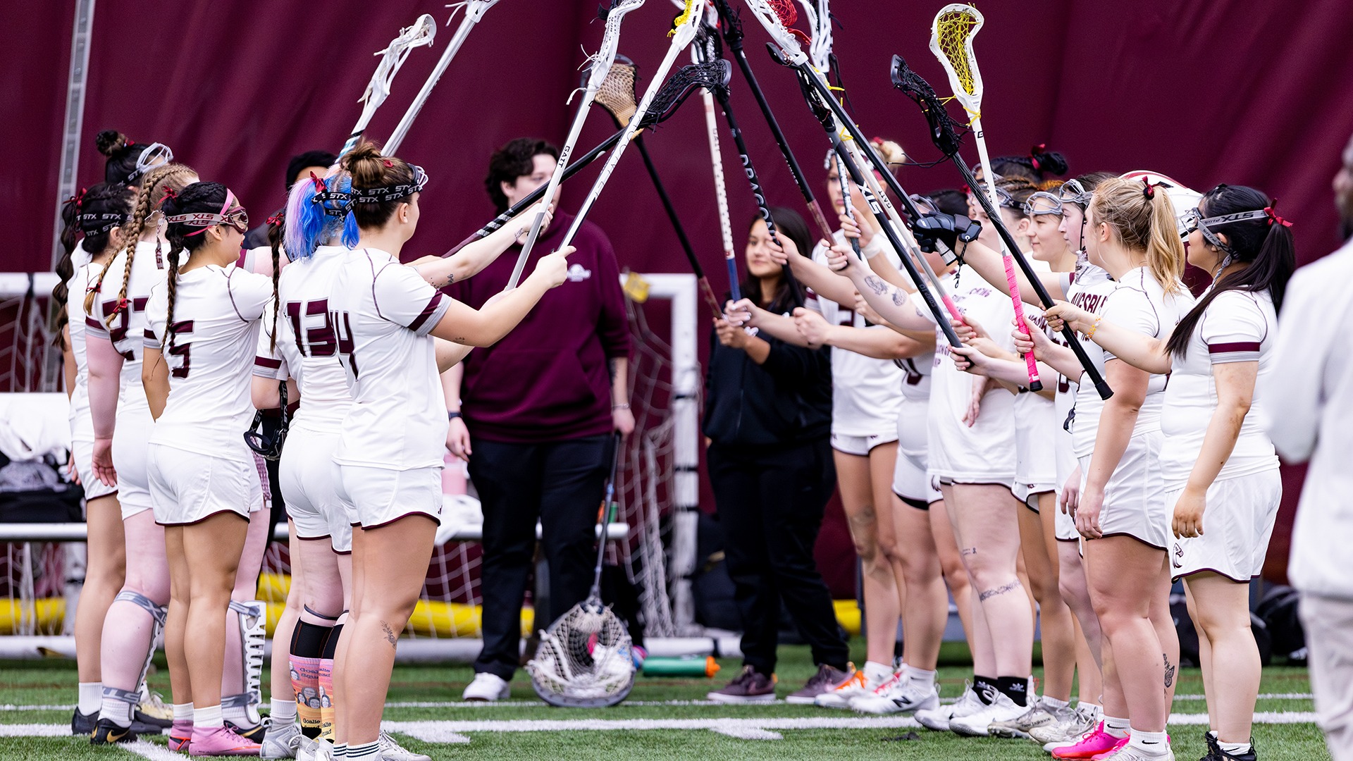 Augsburg players form a tunnel for introductions prior to a 2026 game.