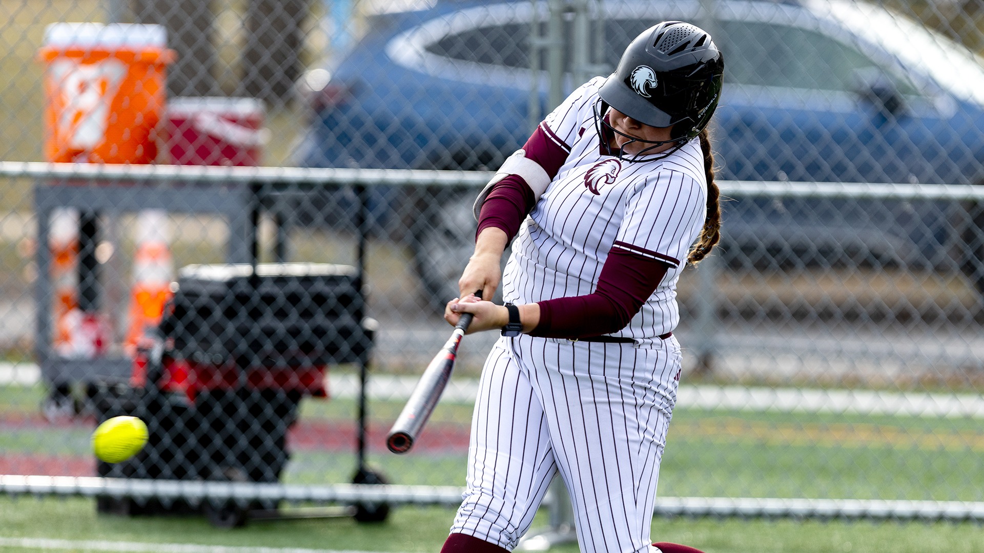 Lola Pilon swings at a pitch during a 2026 Augsburg softball game.