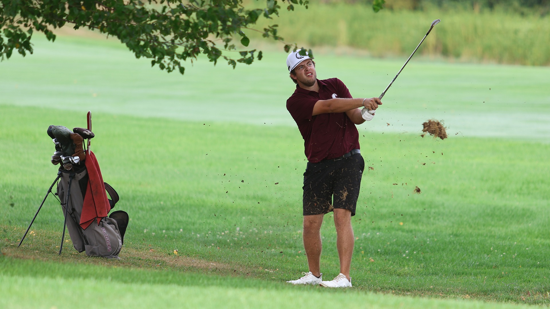 Hunter Ubel hits a shot during a 2026-27 Augsburg men's golf meet.