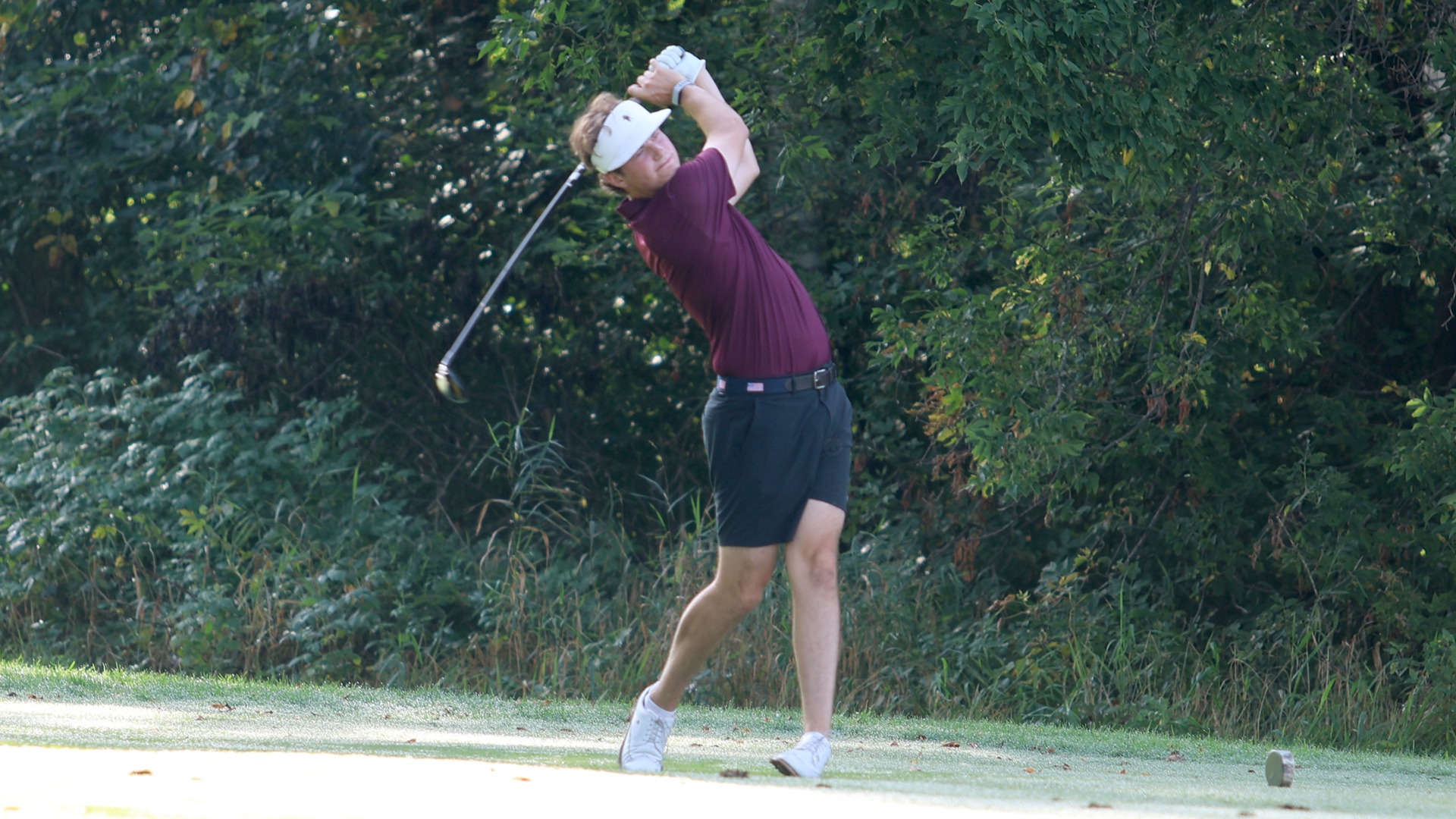 Jack Berry tees off during a 2026-27 Augsburg men's golf meet.