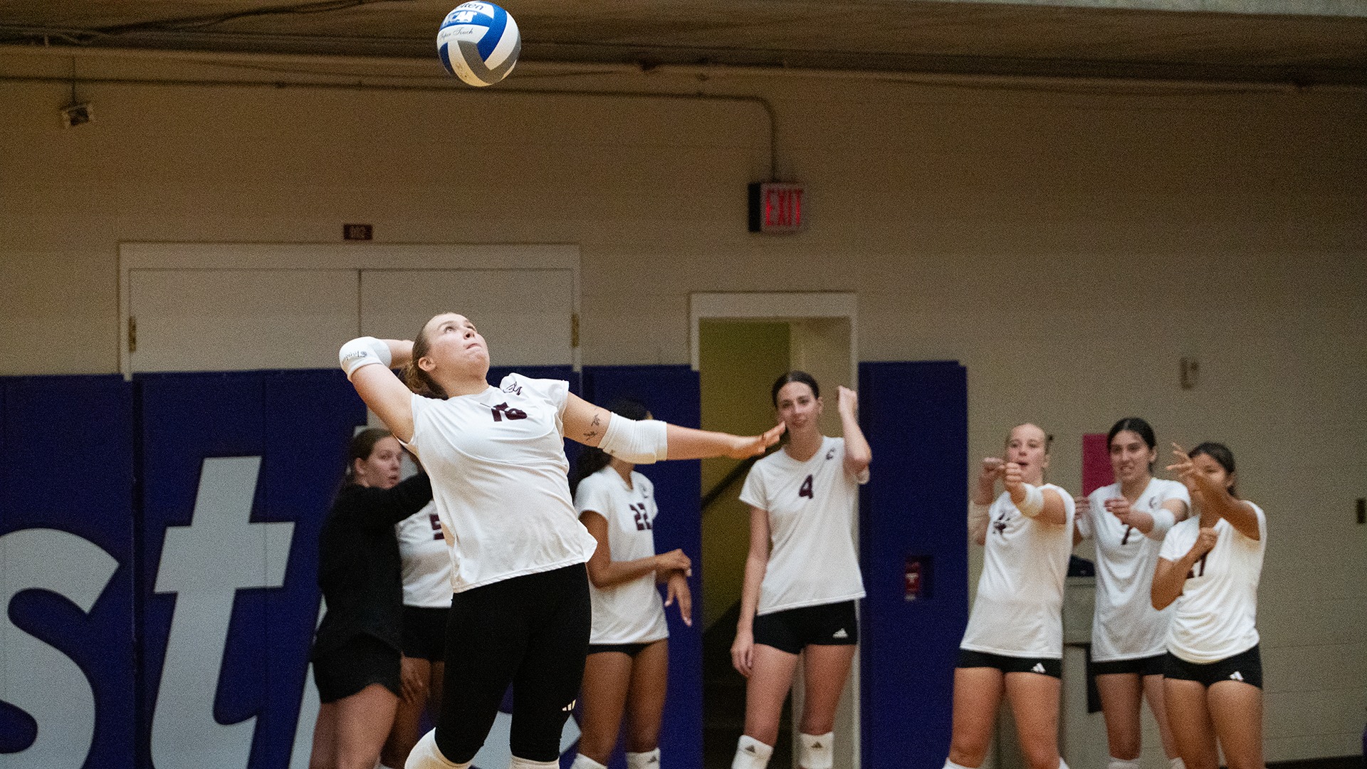 Maggie Lile serves during a 2026 Augsburg volleyball match.