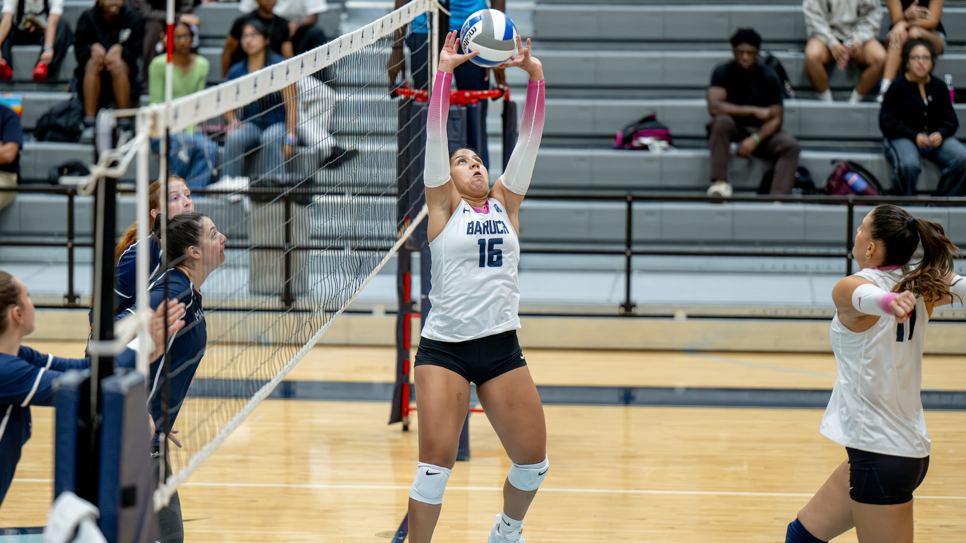 Karen Pozo Castro setting the ball against St. Joseph of Brooklyn.