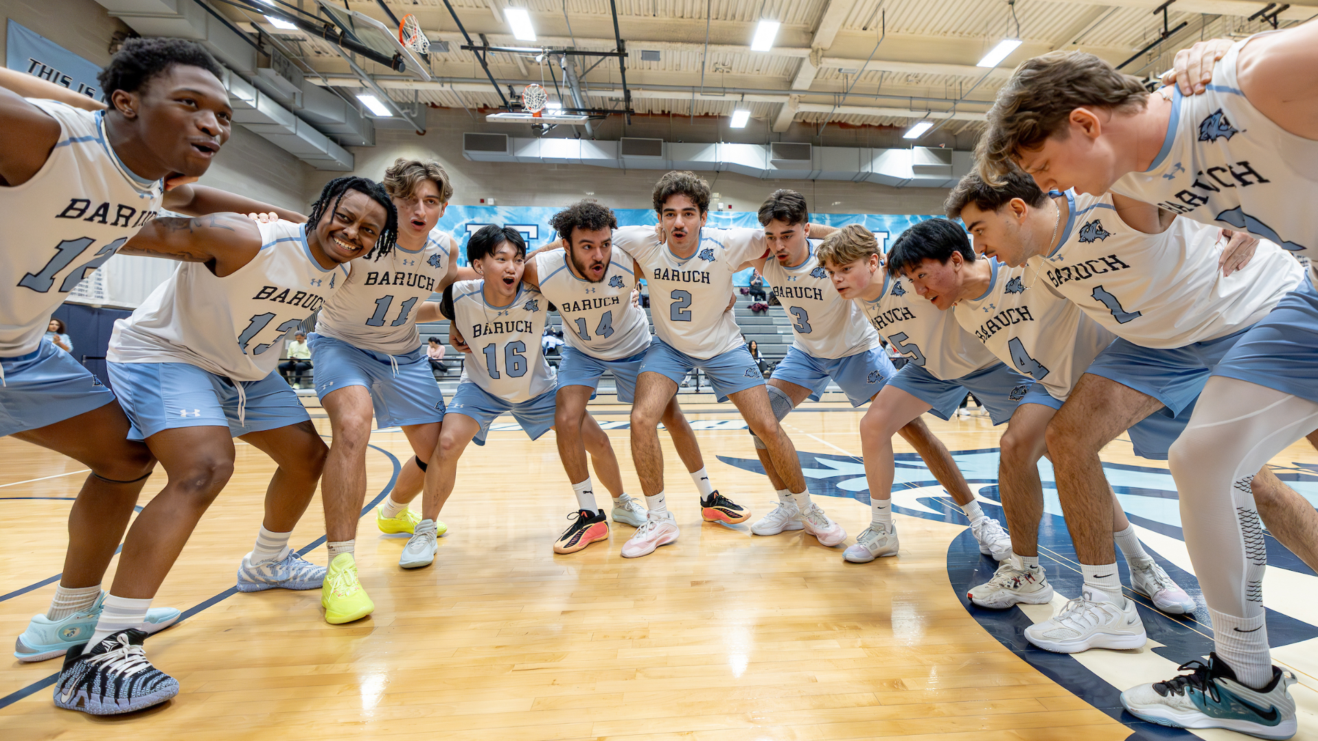 2026 Baruch Men's Volleyball Huddle Photo.
