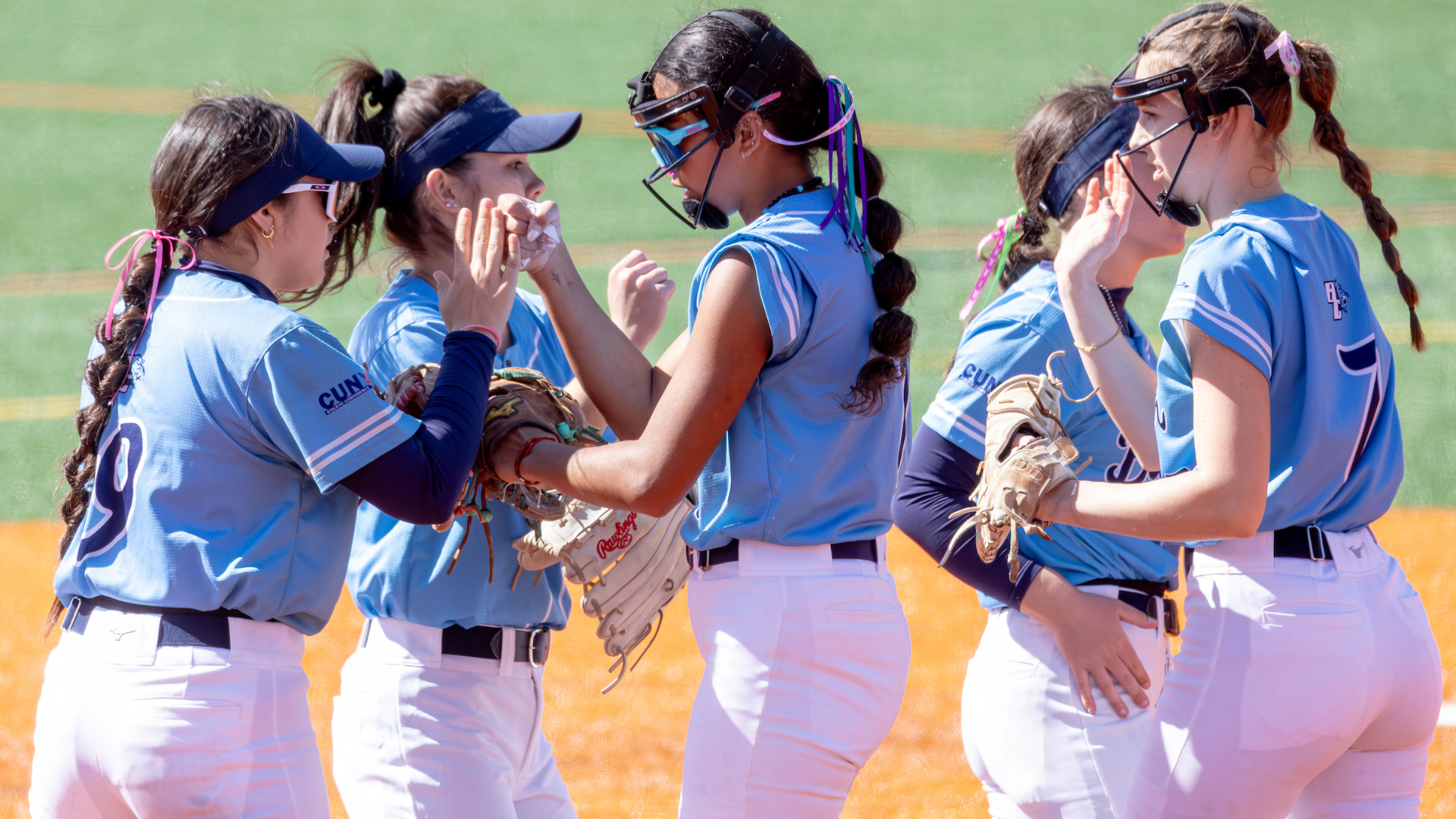 2026 Baruch softball team huddle prior to the first game of the doubleheader. 