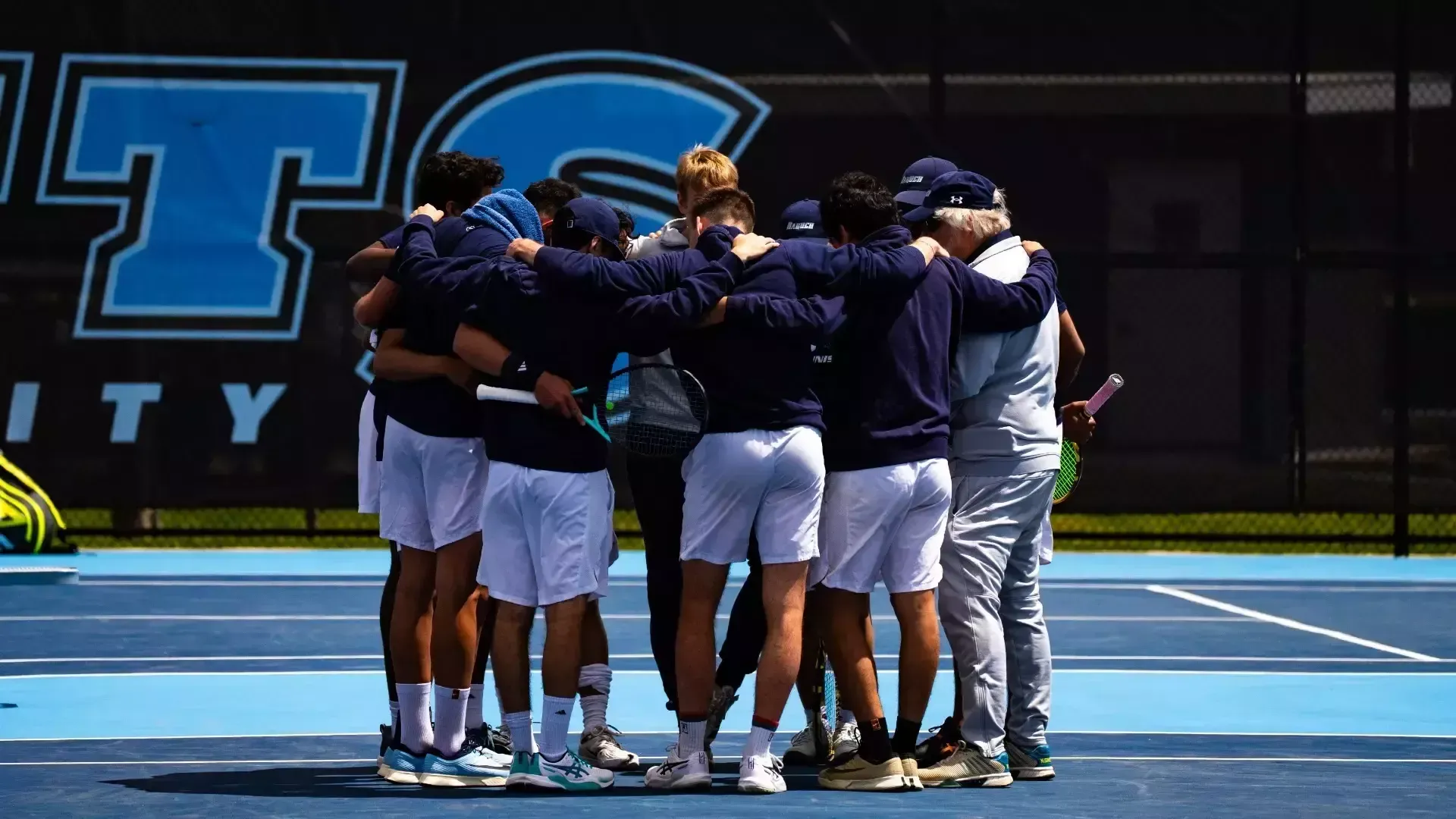 The Baruch men's tennis team at the 2026 NCAA Tournament First Round against Moravian.
