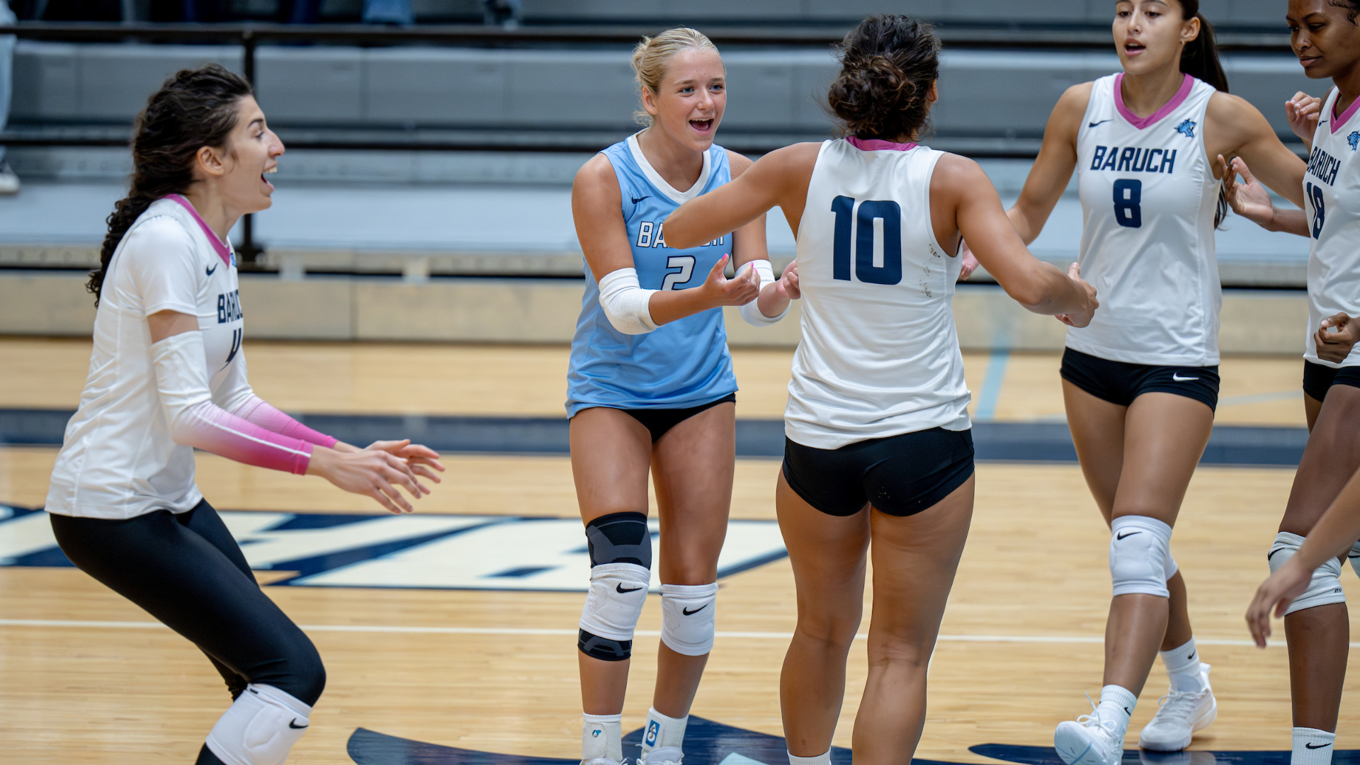 Olivia Mills celebrates a team point. 