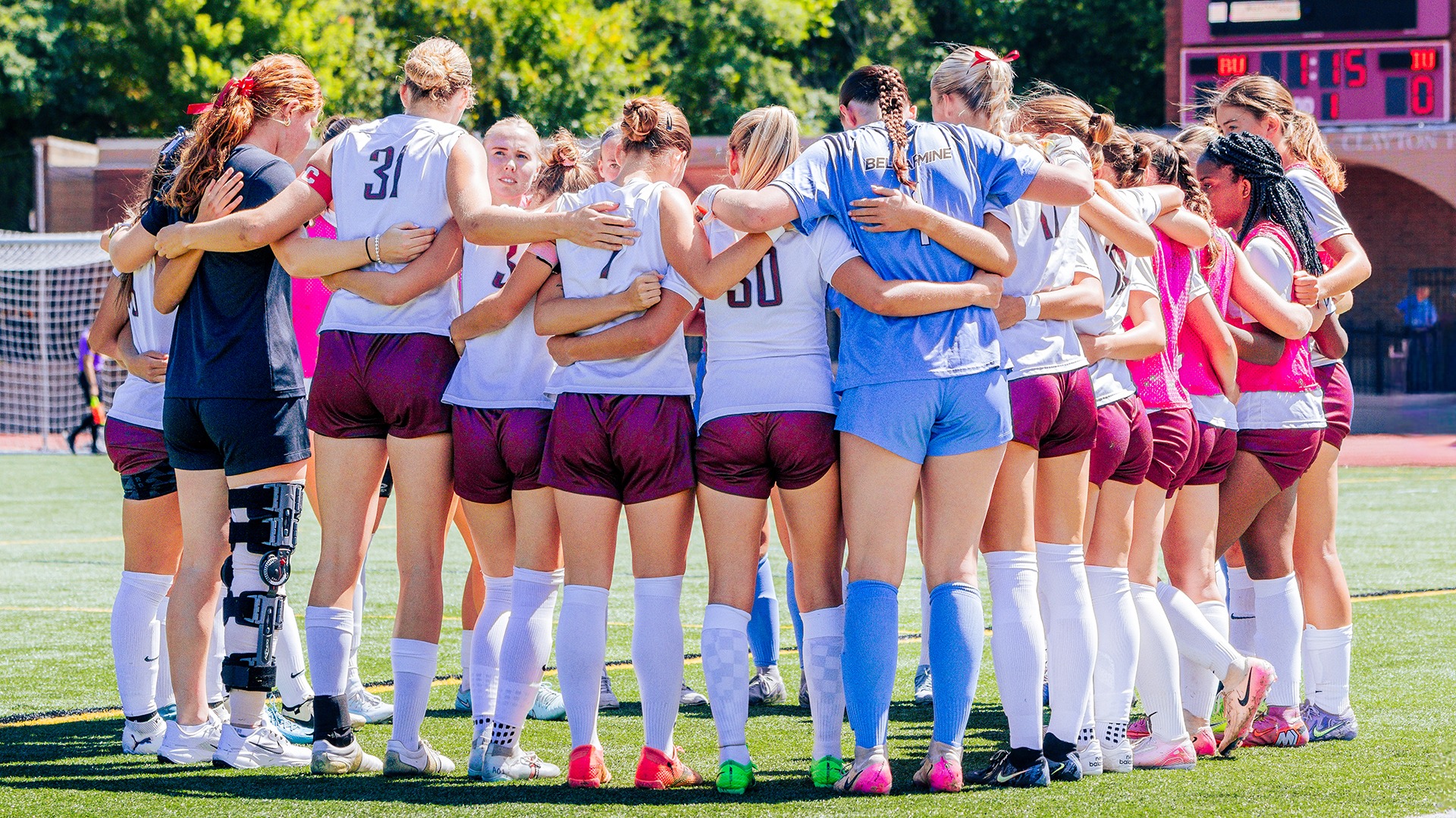 Women's soccer huddles before kicking off against Indiana.