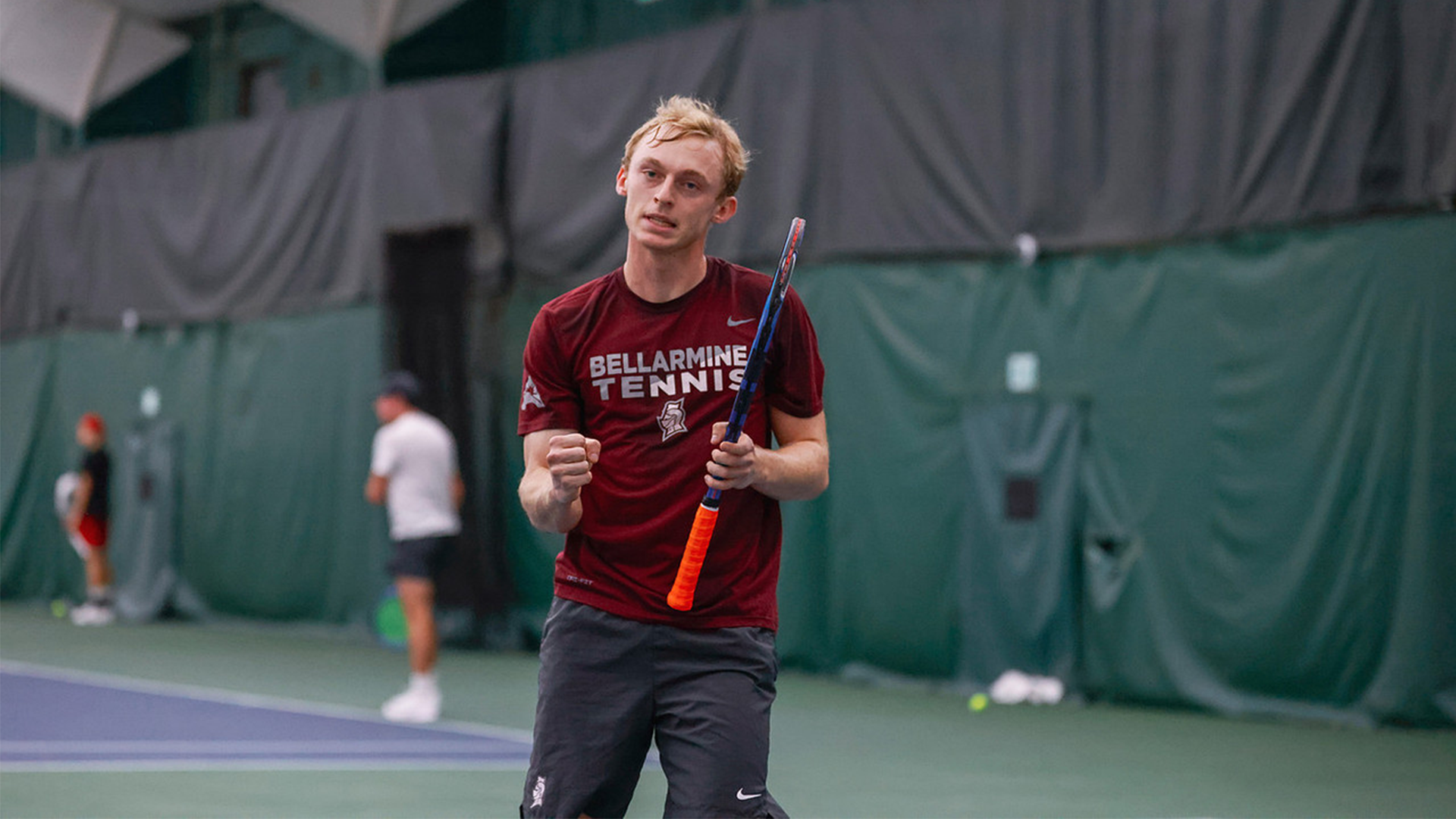 Eli Wood fist pumps after a win at the Ball State Invite