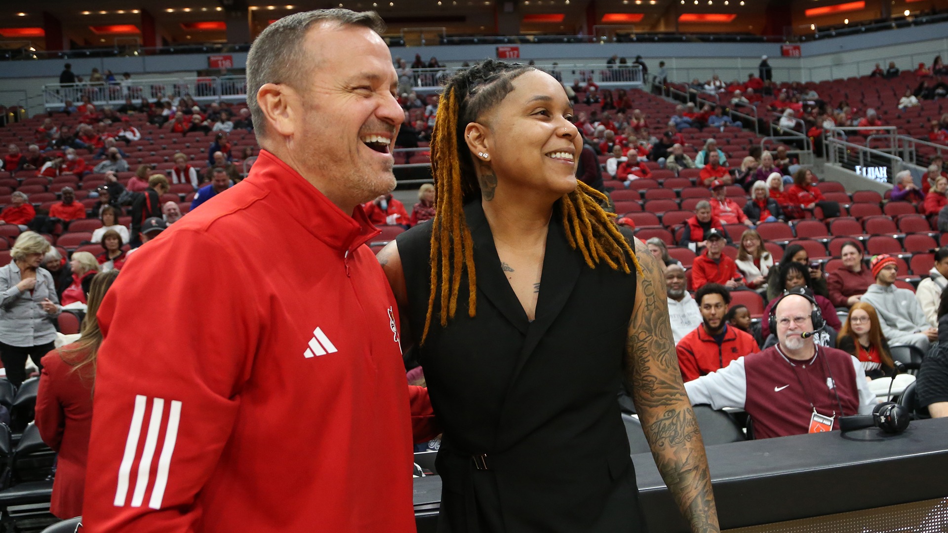 Monique Reid and her former coach at U of L, Jeff Walz, share a pregame embrace.