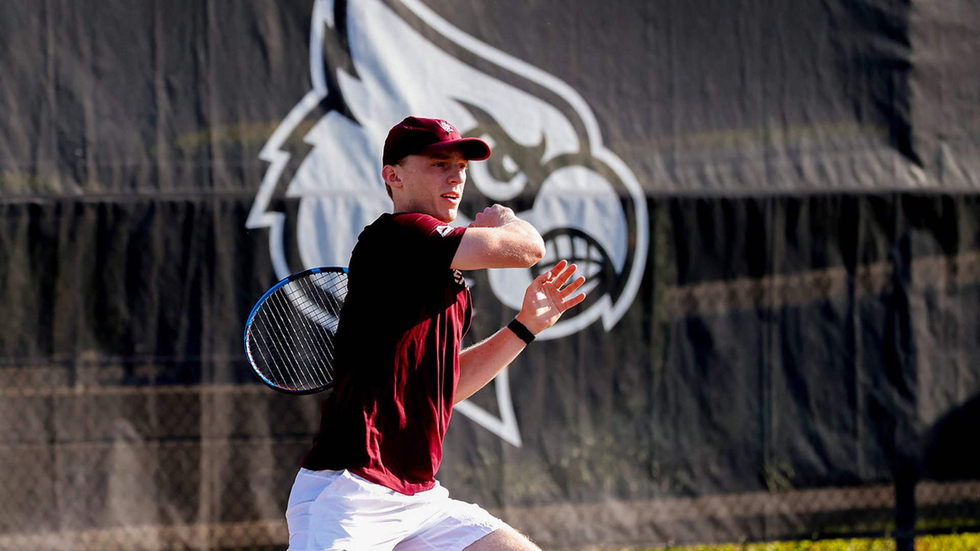 Eli Wood follows through a shot at the Cardinal Invite