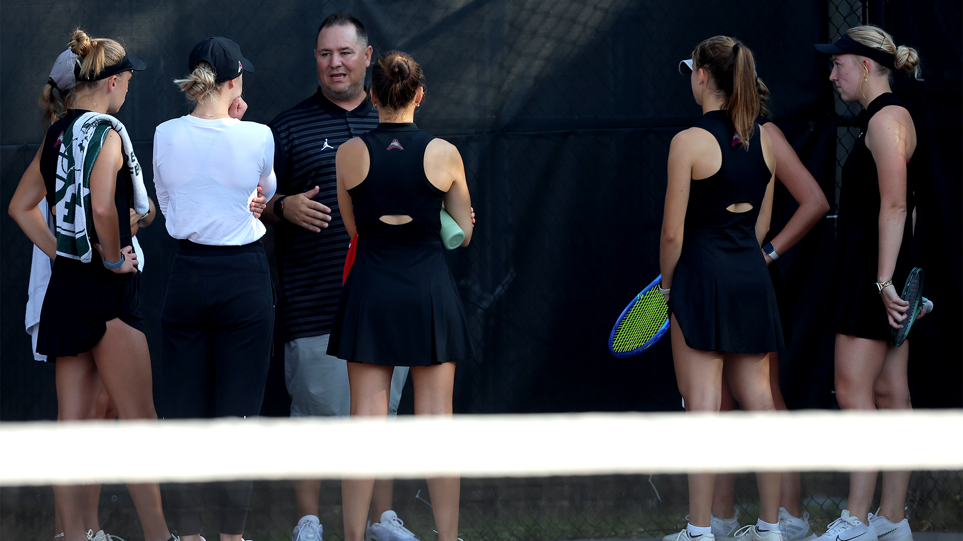 Brian Slack talking with his team between matches