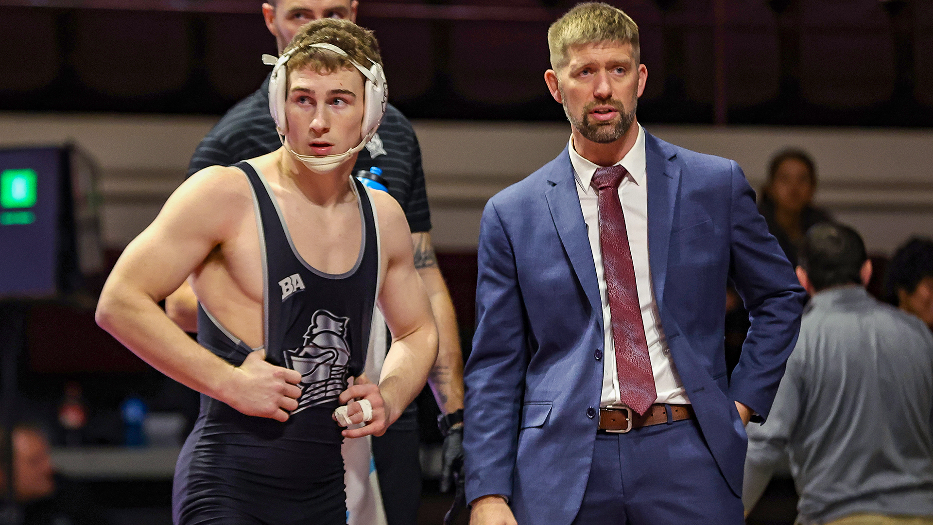 Noah Hall talks with head coach Ned Shuck during an injury timeout against Central Michigan