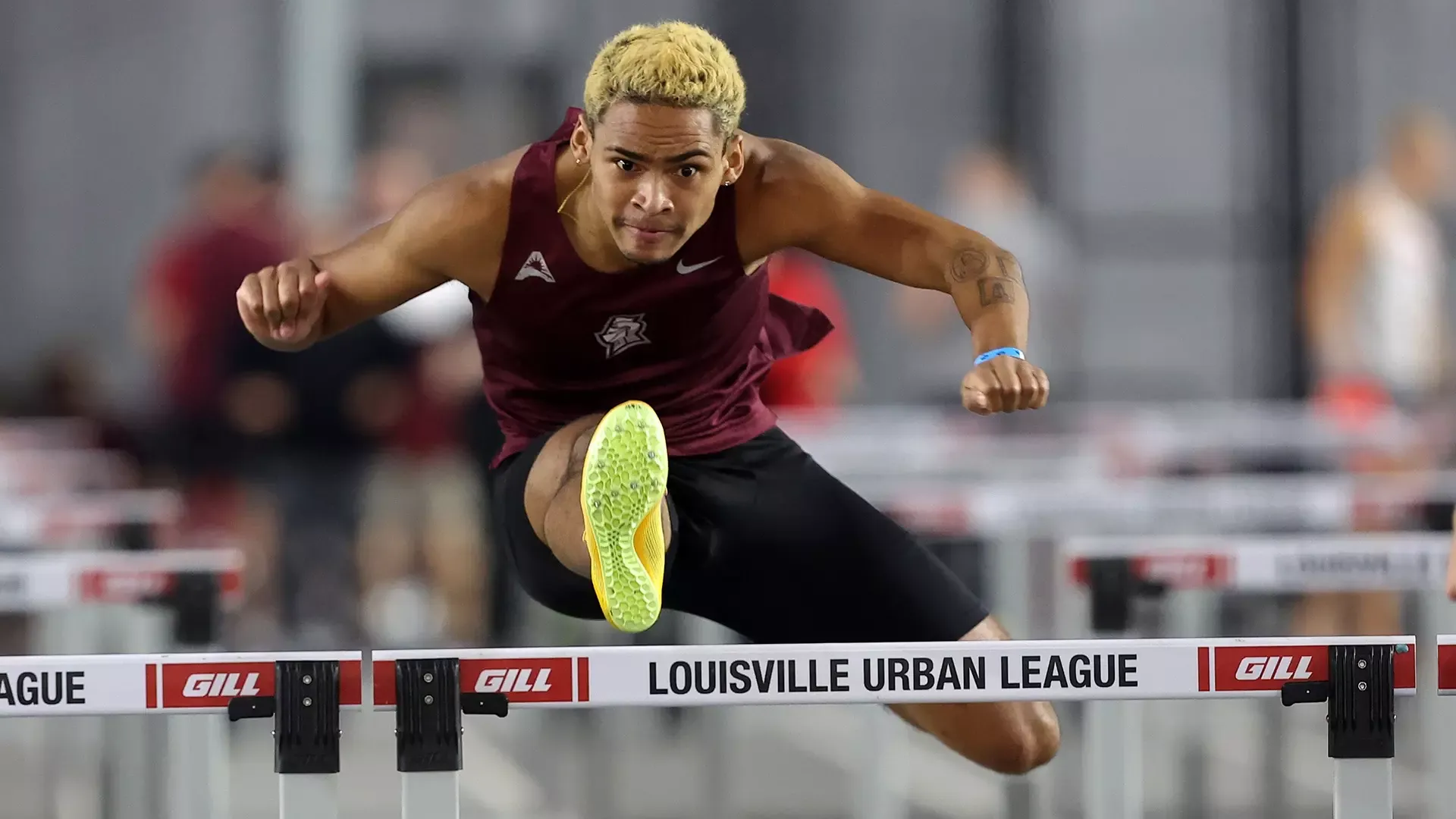 Zander Hooten competes in the hurdles at the Rod McCravy Memorial.