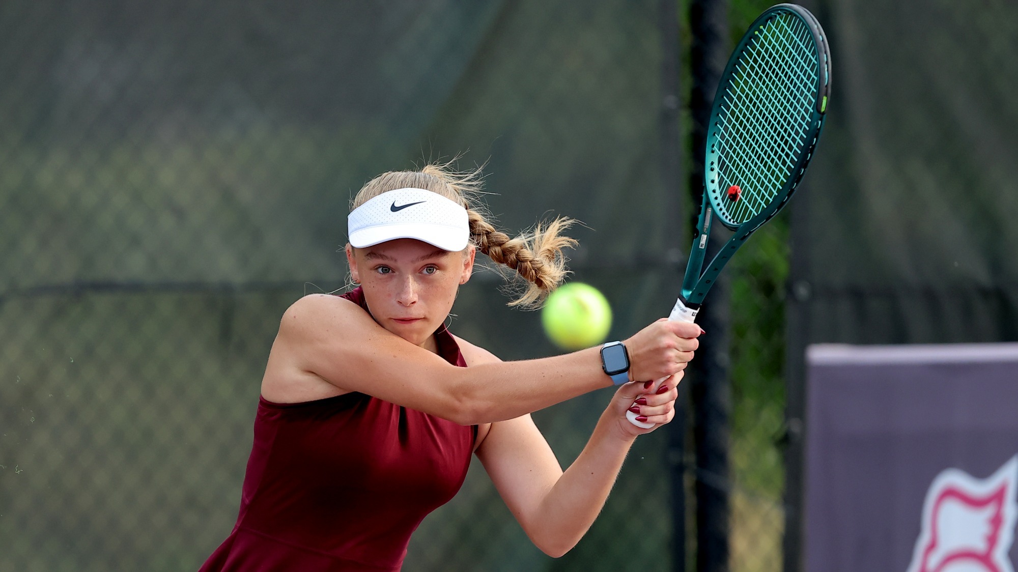 Marika Caruk eyes the ball as she follows through a shot