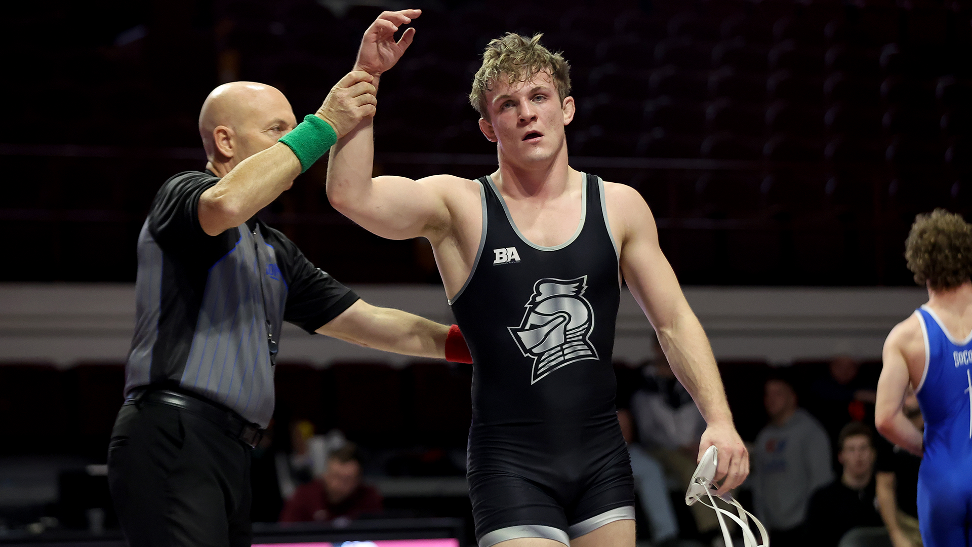 Grant O'Dell has his hand raised after a win over Presbyterian