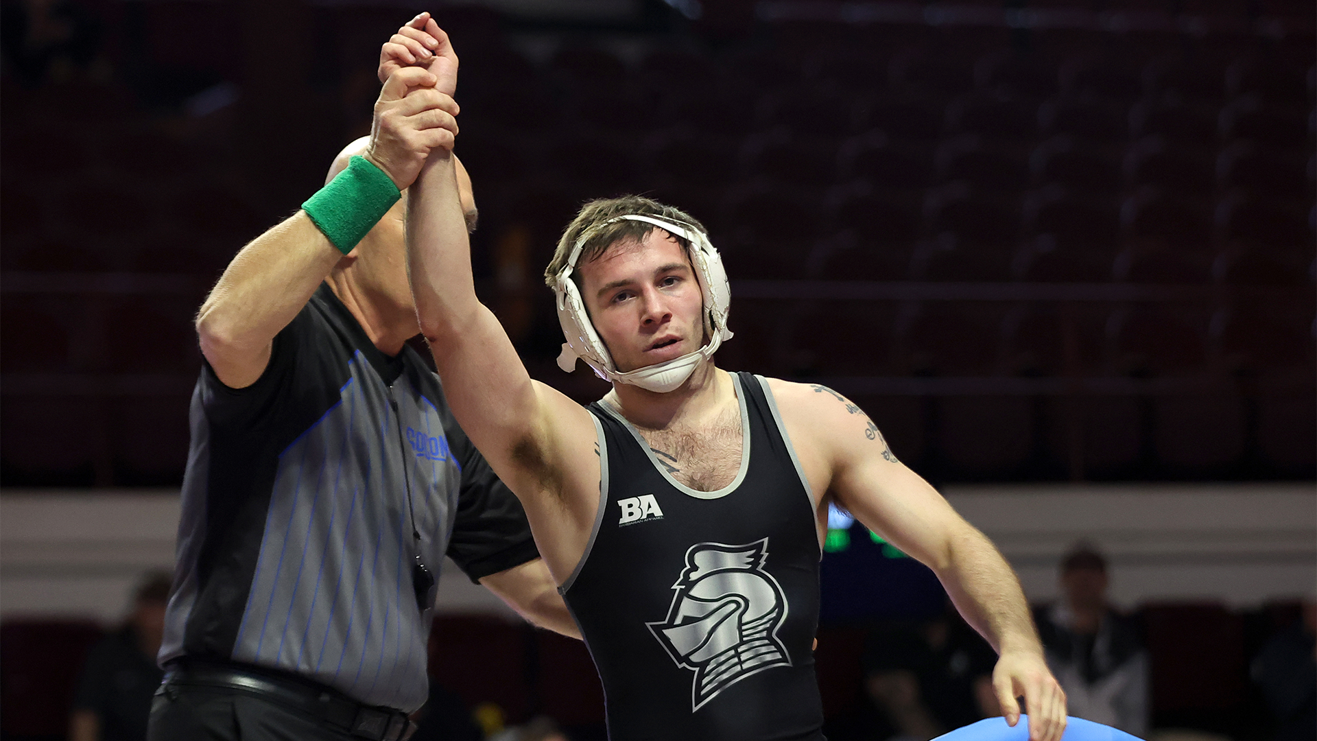 Damion Ryan has his hand raised after his win over Presbyterian