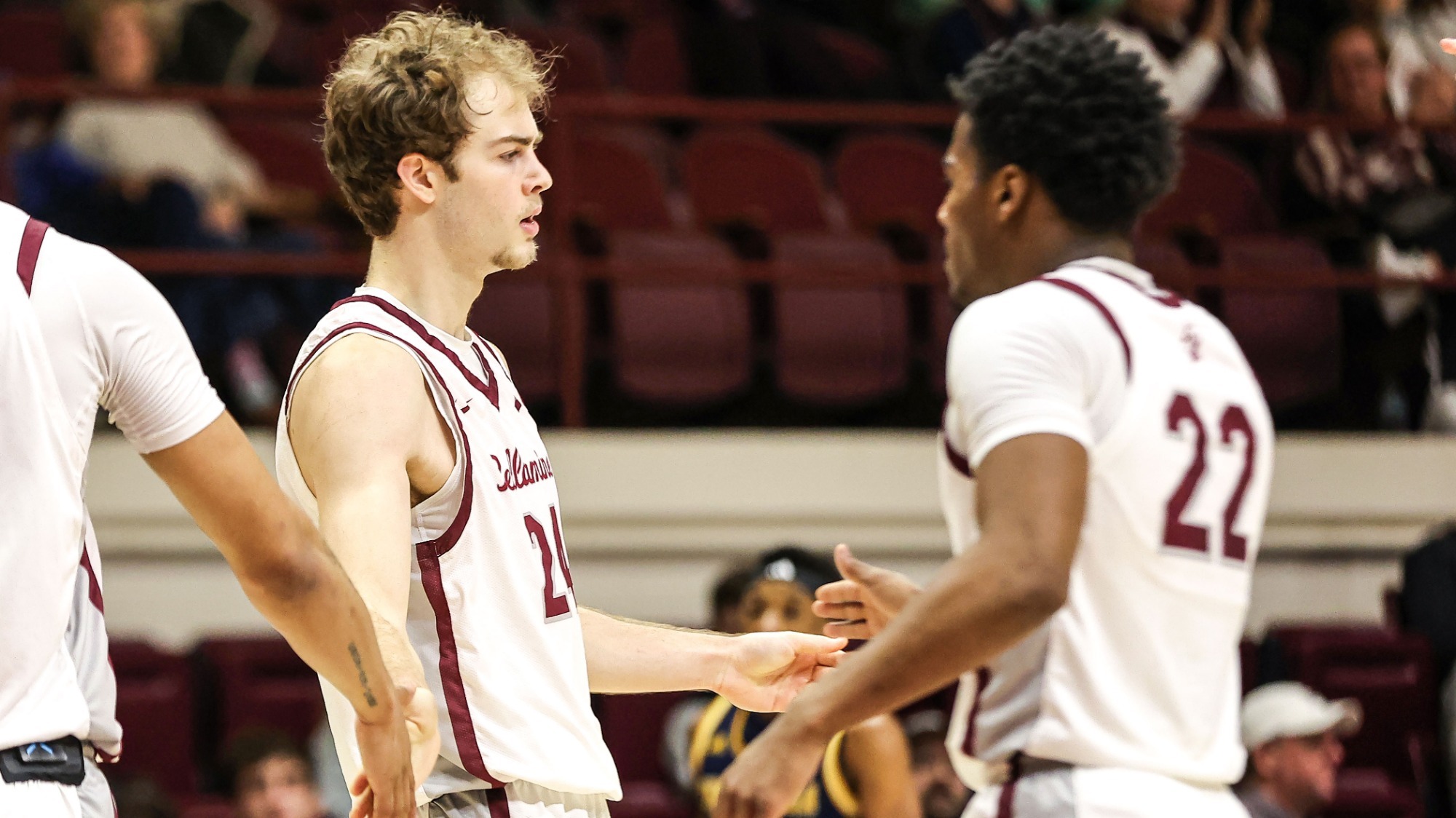 Michael Wilson and Darrius Bolden high-five celebration