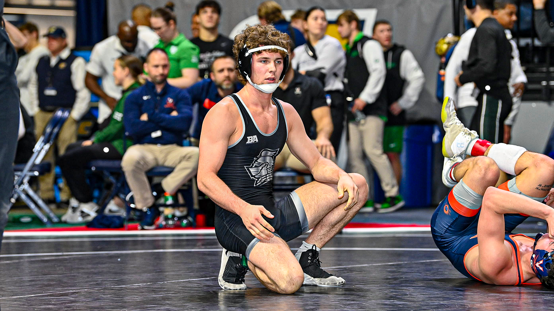 Jeb Prechtel resets on the mat during a match at the Southern Scuffle