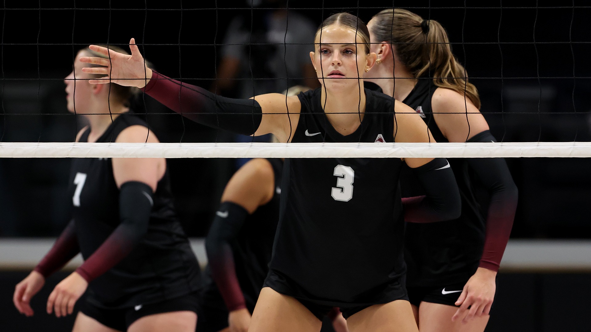 Erika Smith gets ready for a serve in a match this season.