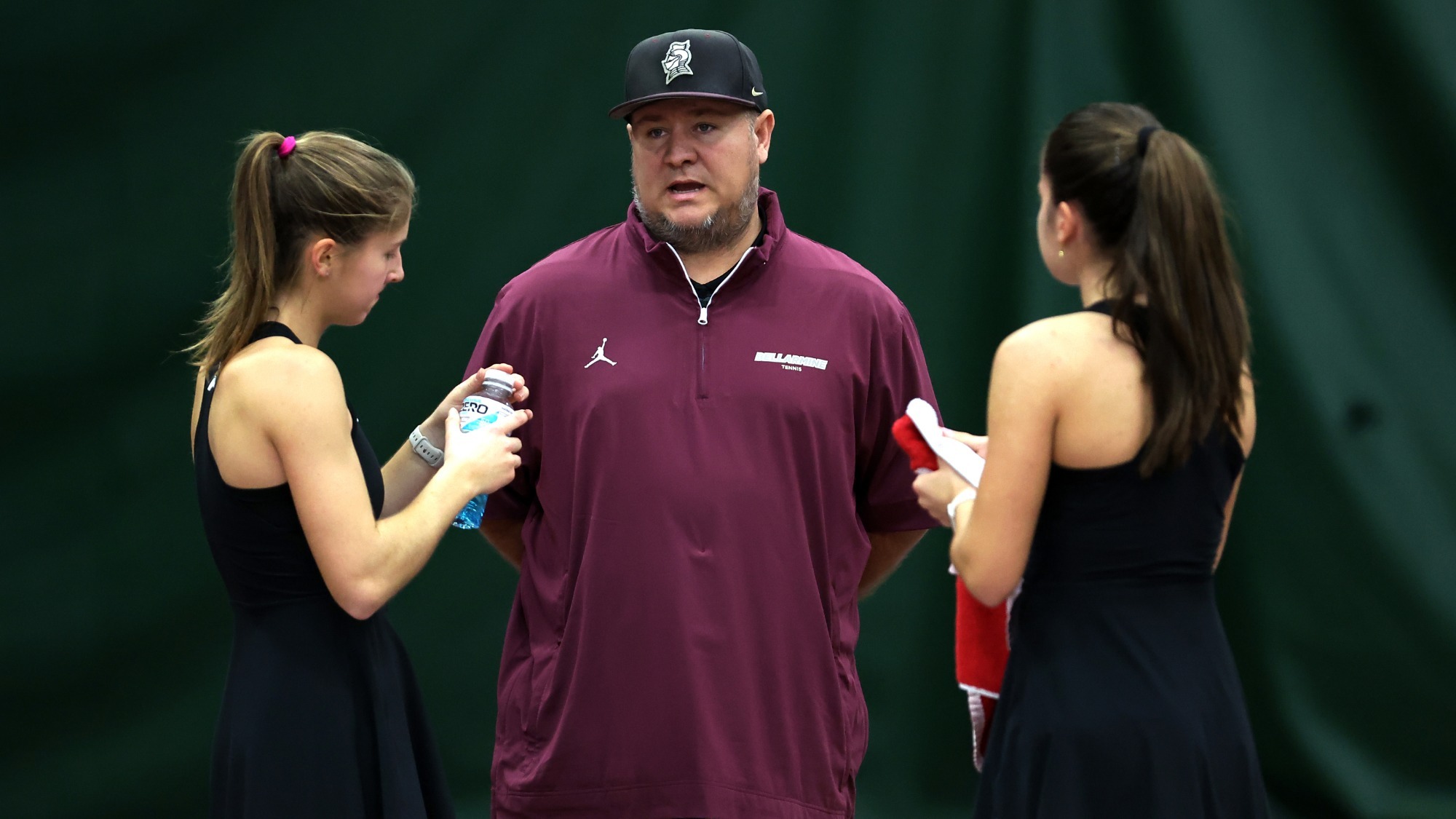 Head Coach Brian Slack talks with Nikola Kollaritsch and Claudia Fuste Fernandez