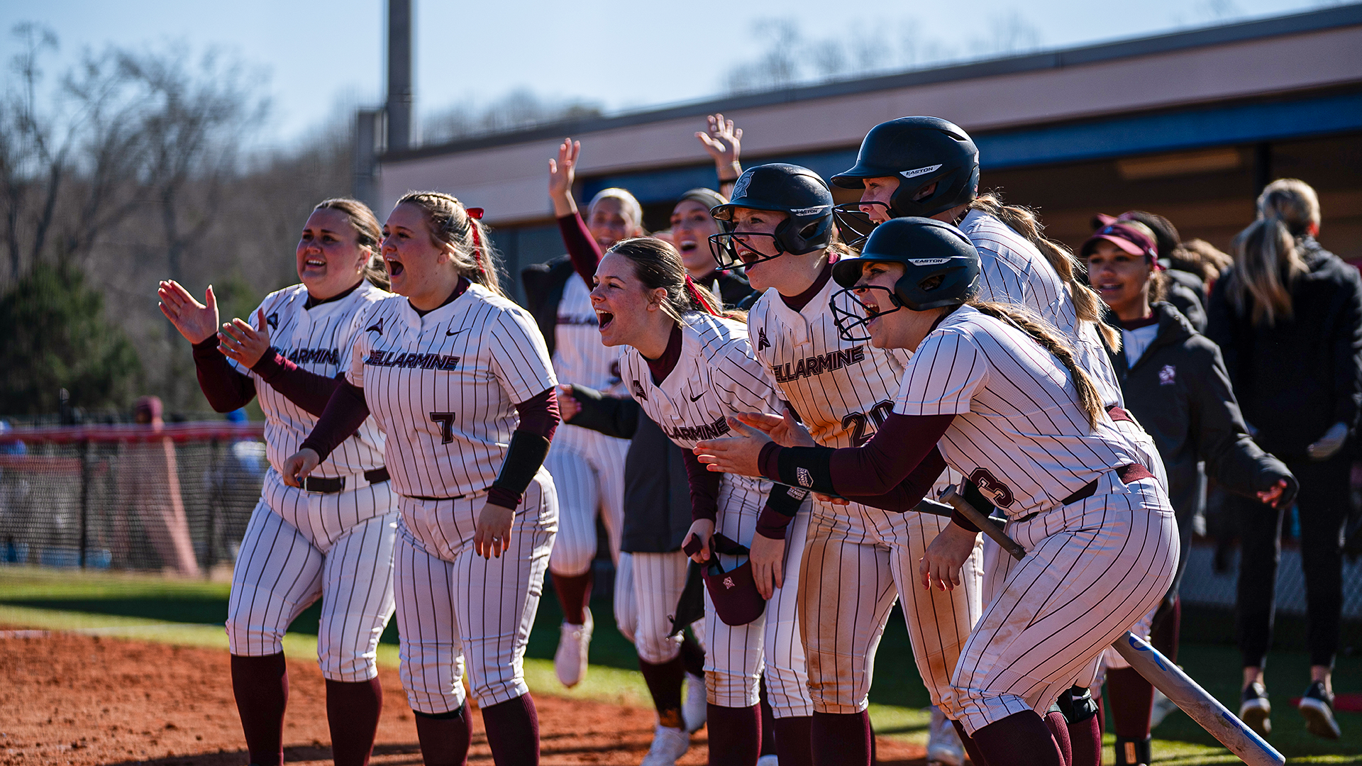 Addison Kerr, Natalie Kerr, Lily Jones, Jacklyn Zuege and Nicole Waters surround home plate as they celebrate a Tia Ice home run
