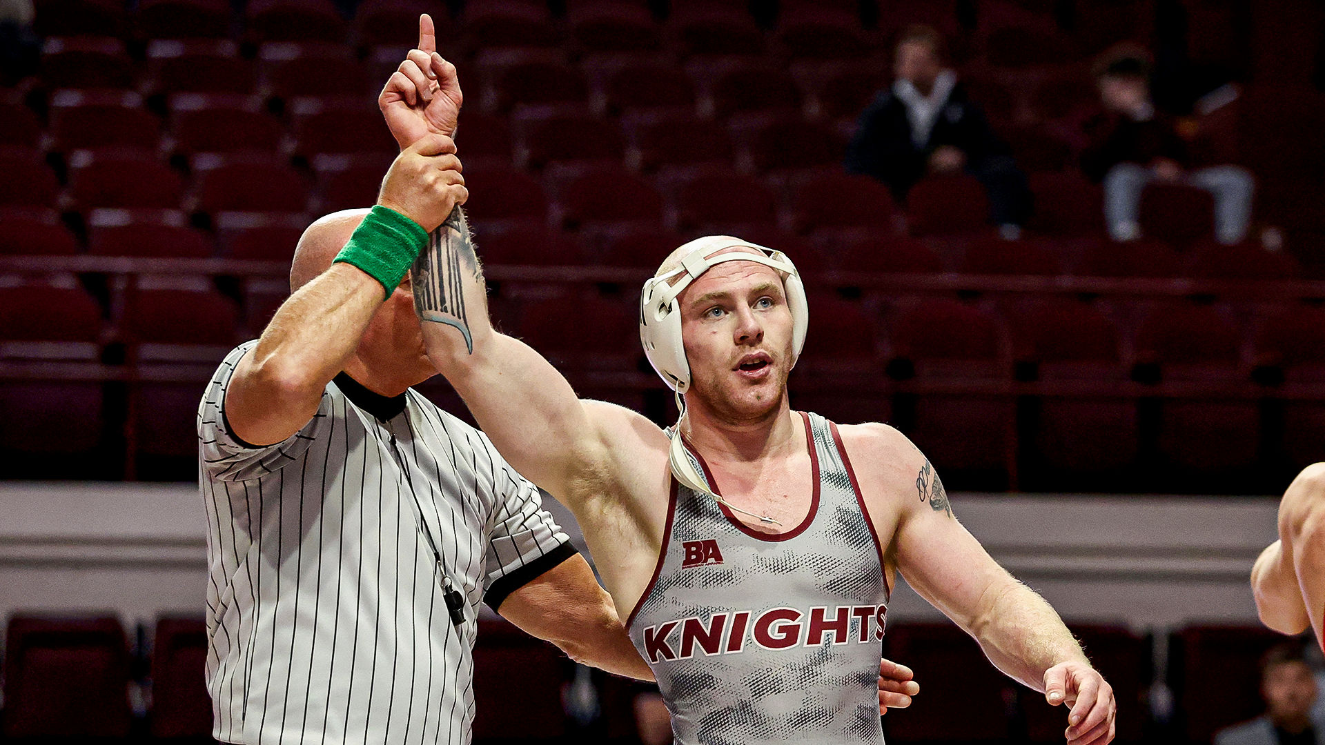 Nate Higley has his hand raised after his won over Gardner-Webb