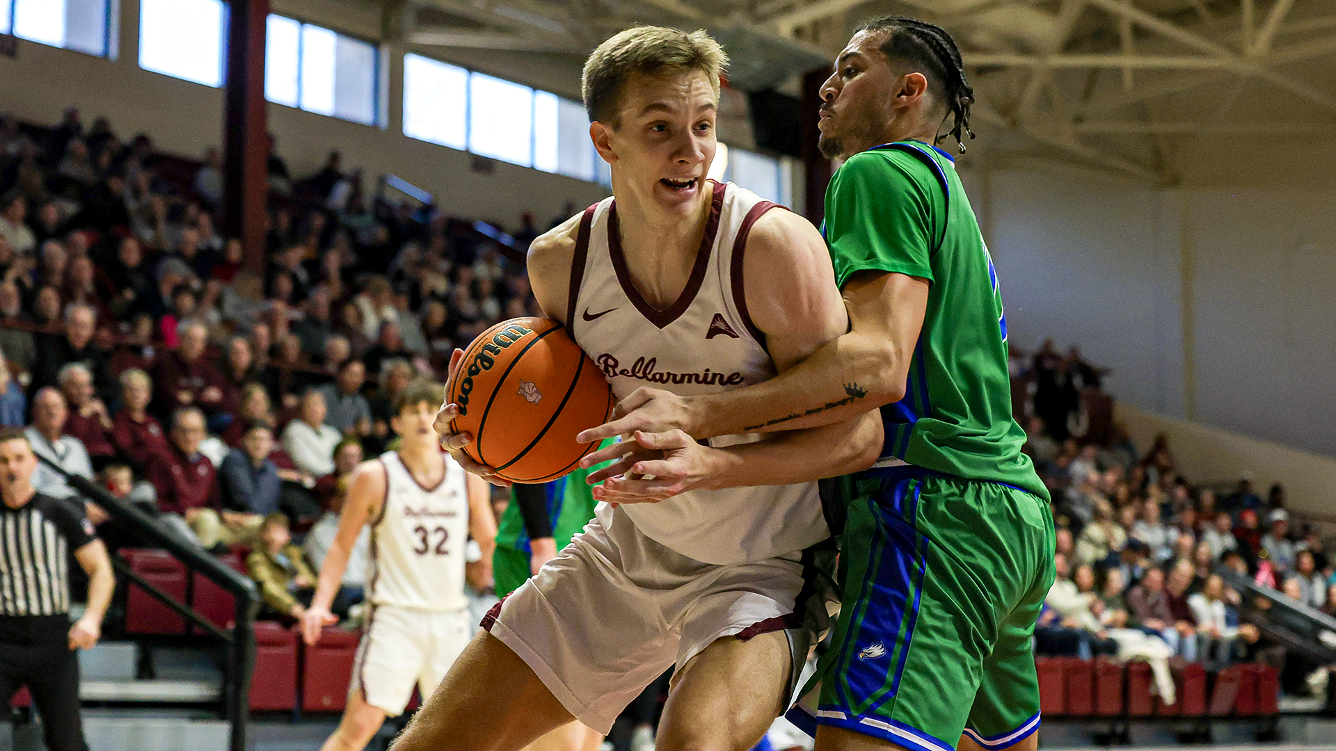 Brian Waddell takes the ball into the chest of a FGCU player
