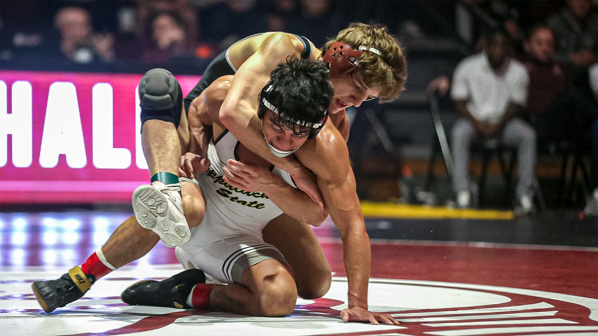 AJ Rallo holds on to his App State opponent from behind