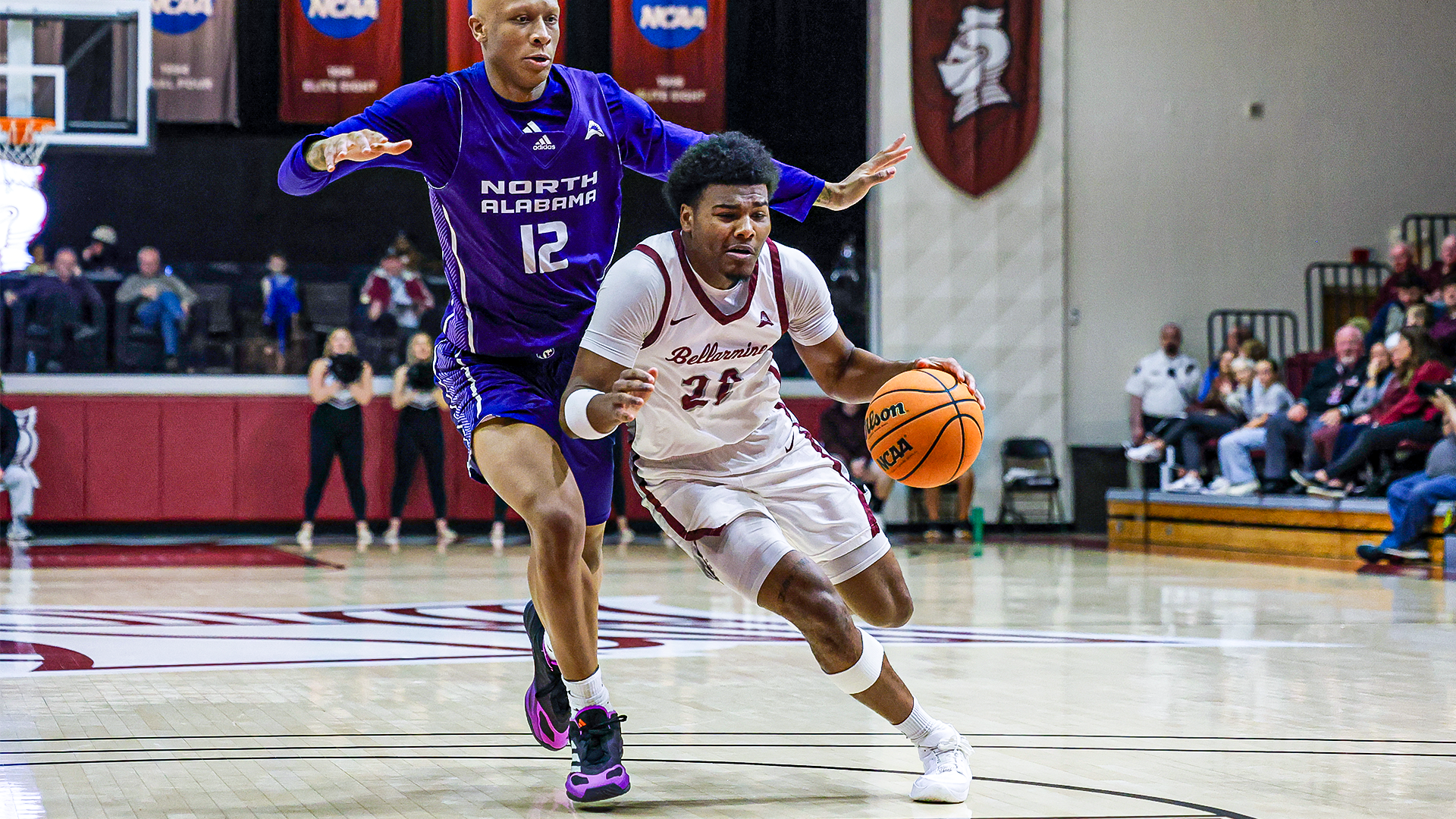 Darrius Bolden fends off a UNA player