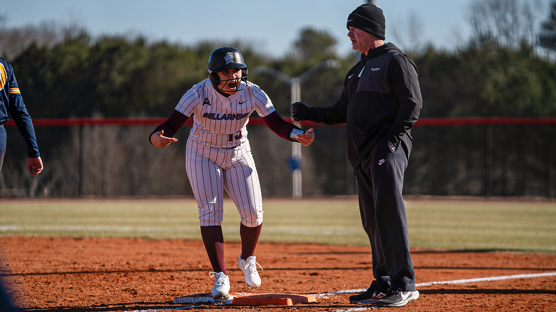 Nicole Waters celebrates on first base