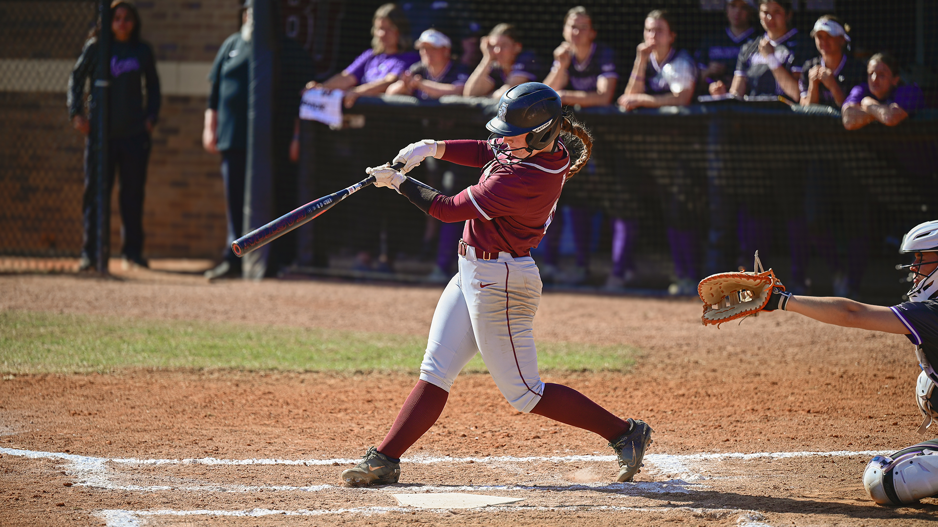 Jacklyn Zuege follows through contact at the plate