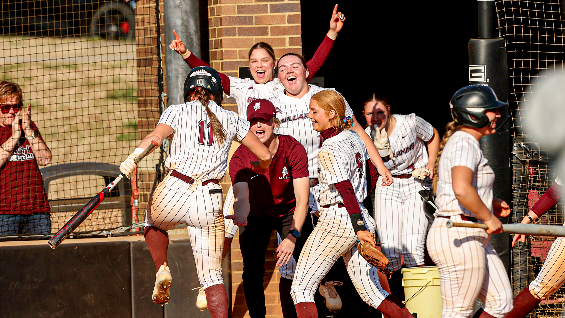 Kendall Gaddie celebrates with the dugout after an RBI double
