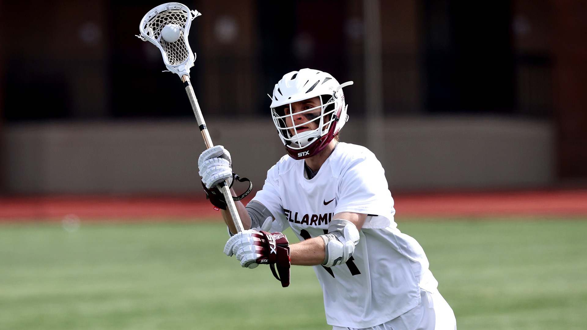 A Knight lacrosse player looks to pass against Long Island.