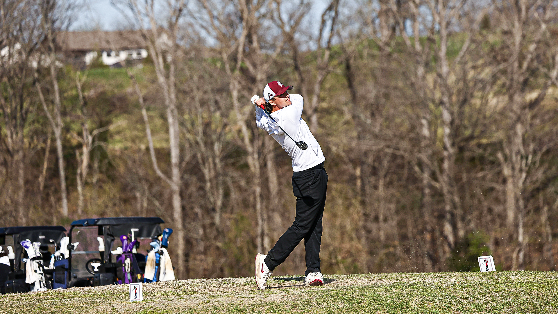 Landon Stillwell holds his finish on a par-3 tee shot