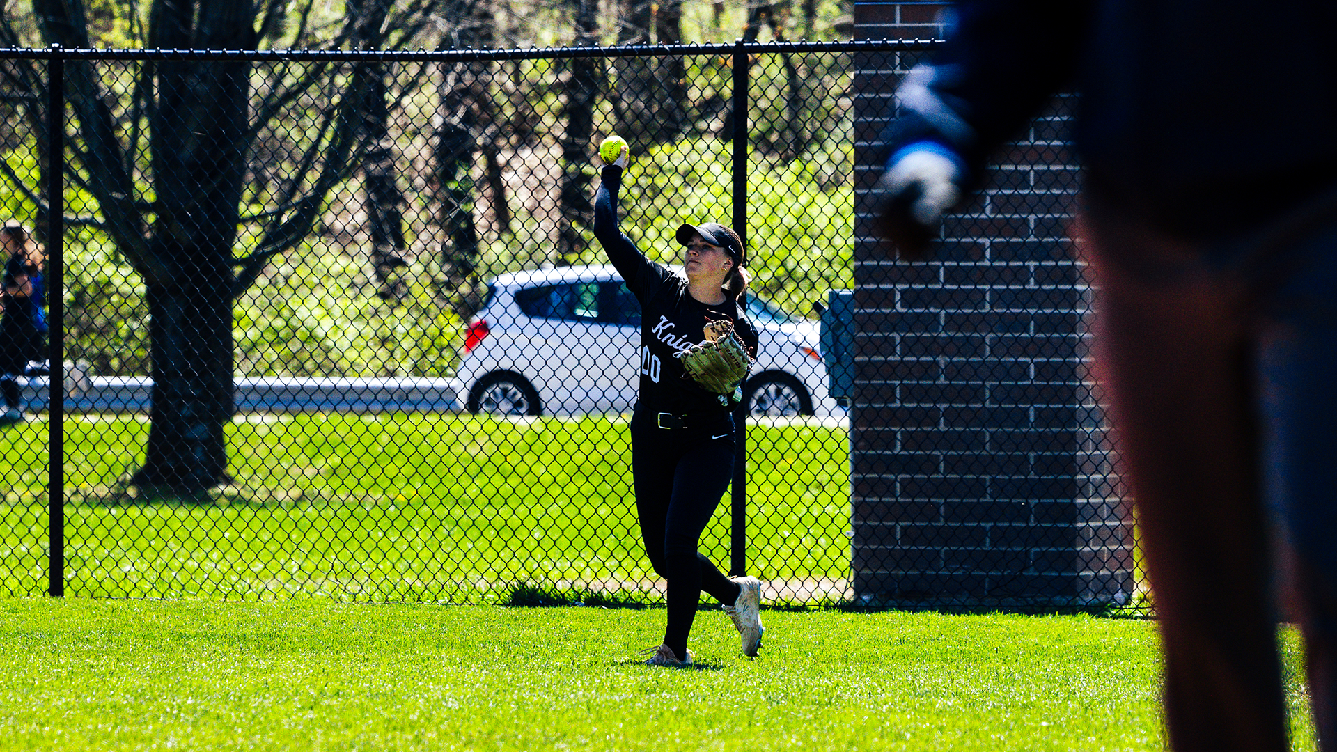 Brooke Shewmaker throws a ball in from right field