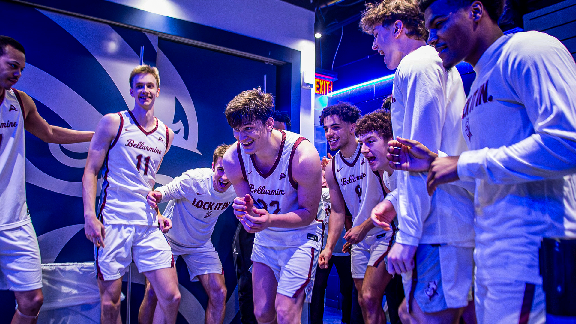 Men's basketball celebrates in Round 1 ASUN Championship win in the locker room
