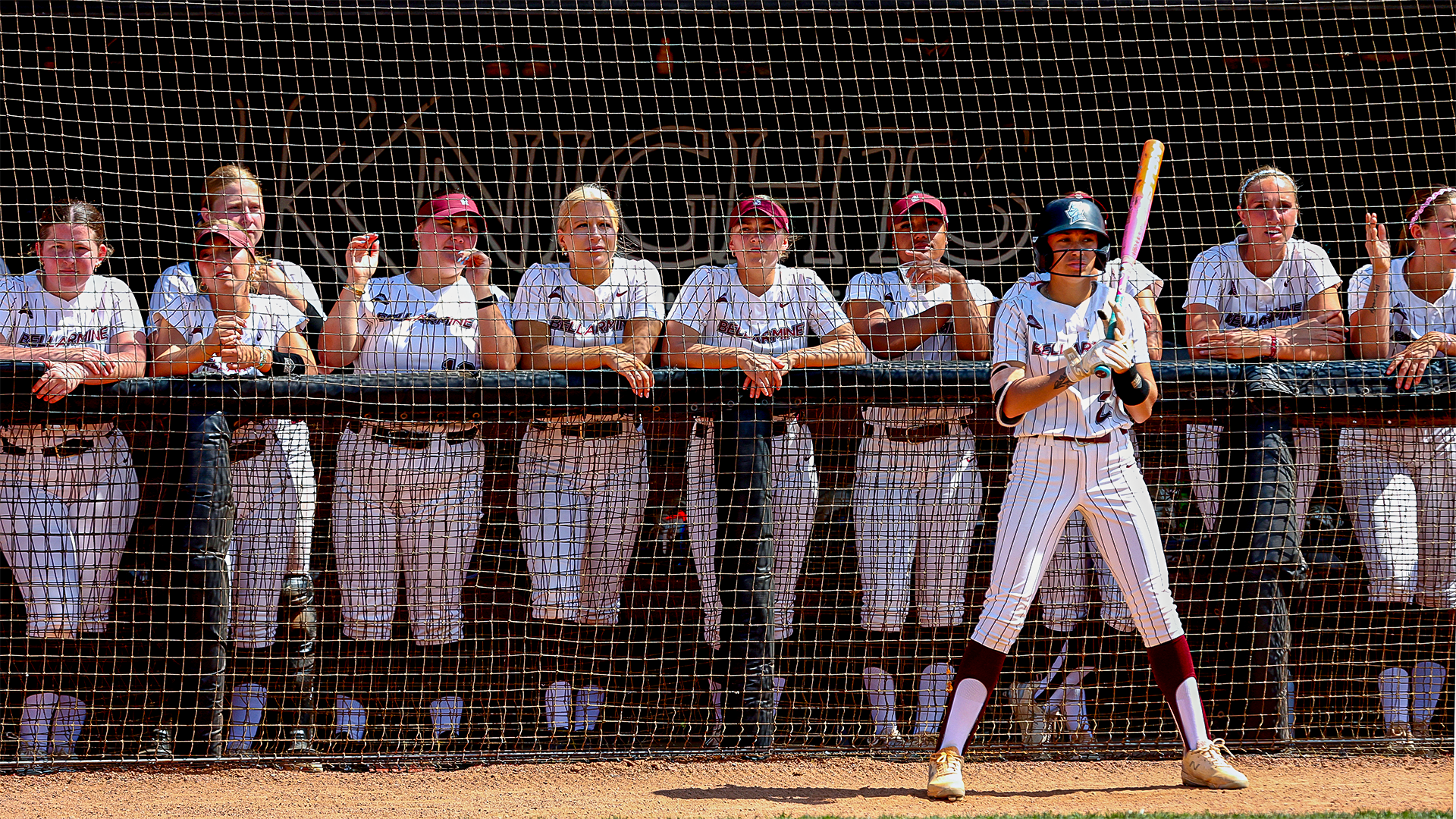 Jayla Manning in the on-deck circle in front of the dugout
