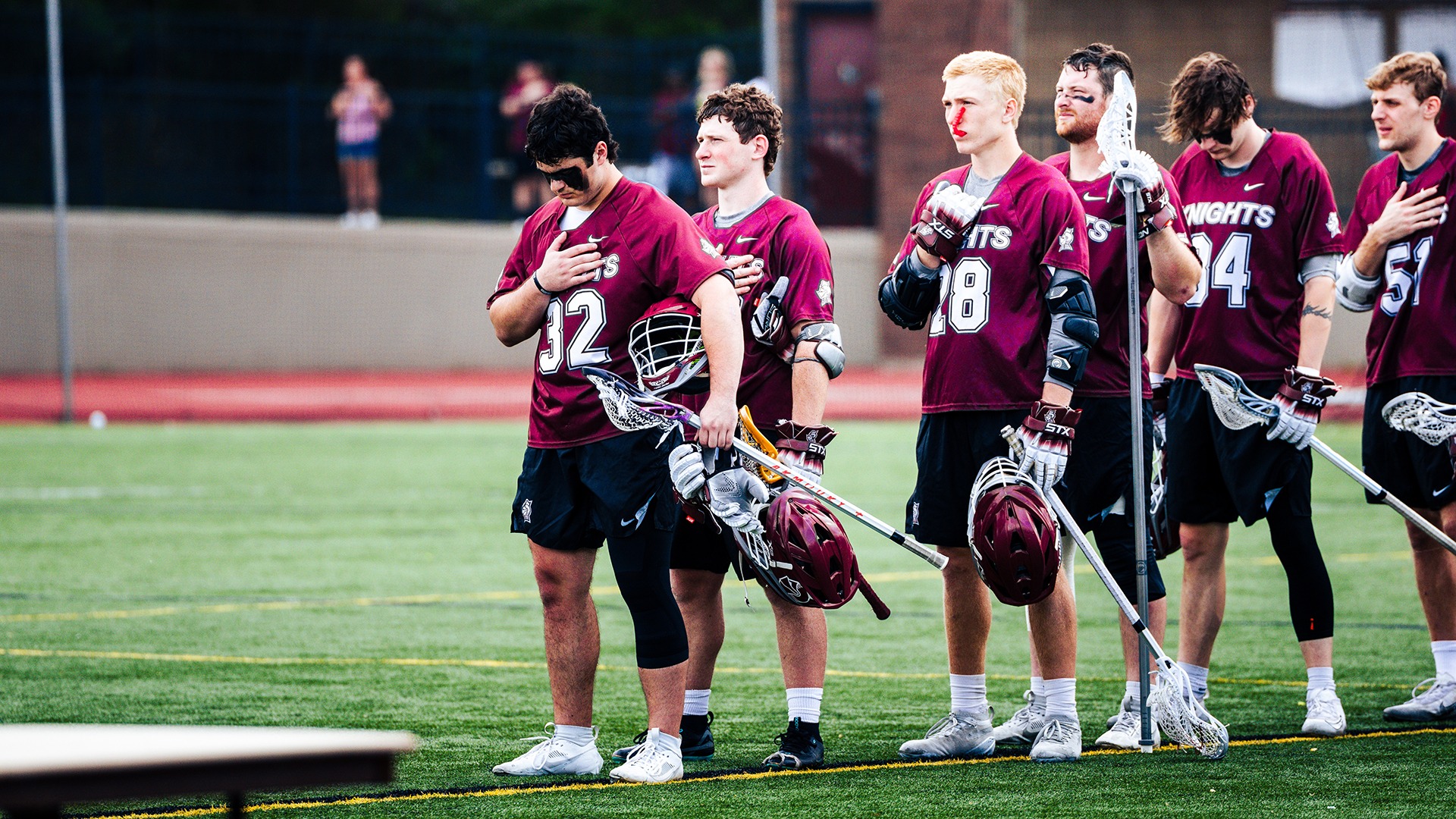 Knights listen to the National Anthem before the Air Force game.