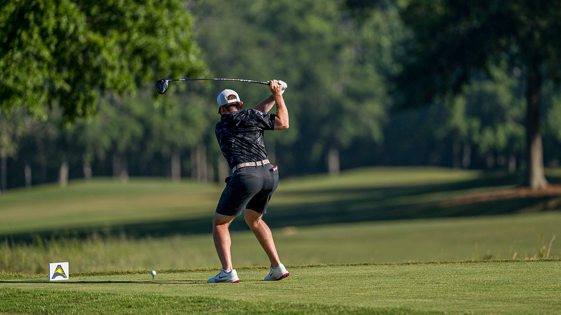 Ben Davenport at the top of his backswing on the tee box at the ASUN Conference Championship
