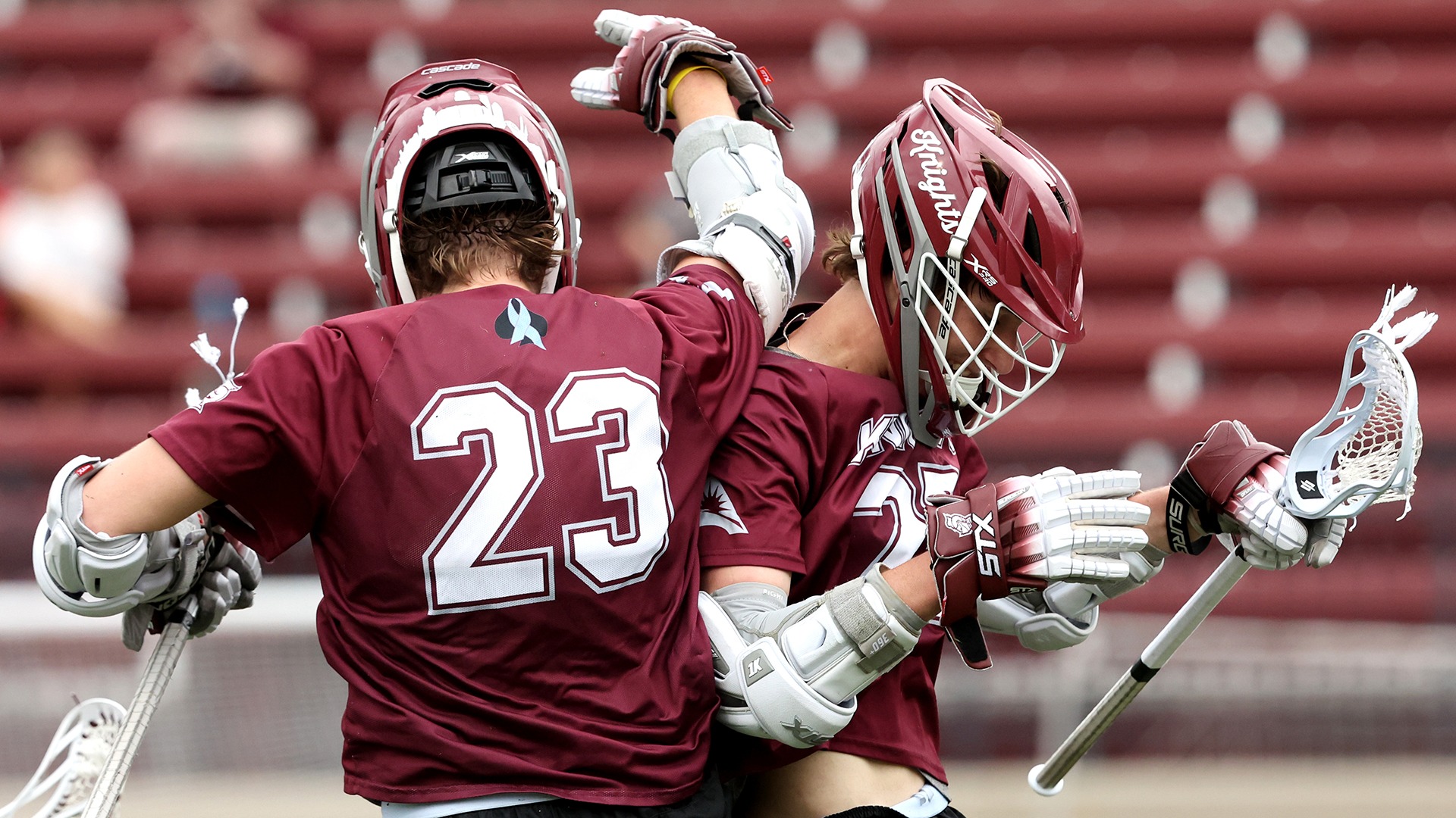 Brothers John and Joe Alie celebrate a goal against Air Force.