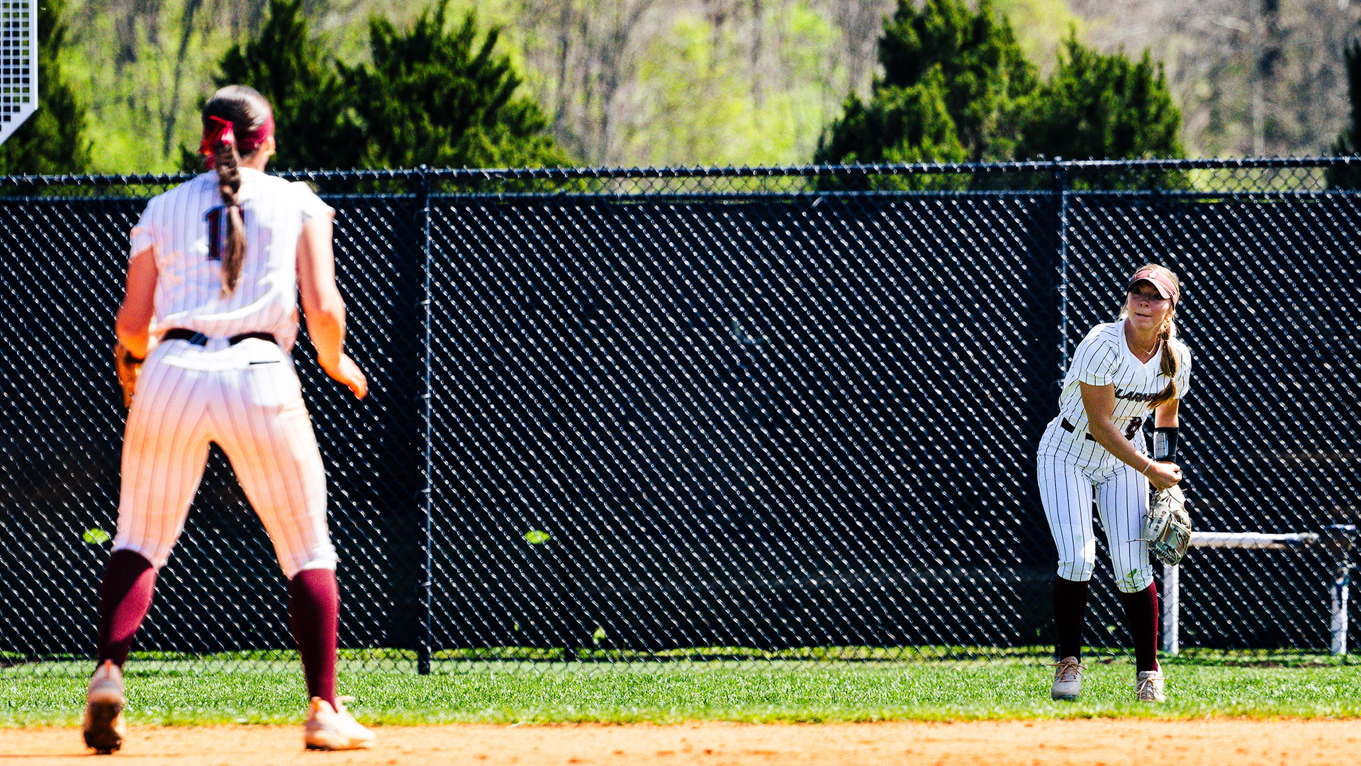 Madison Davis throws in to Kendall Gaddie from left field
