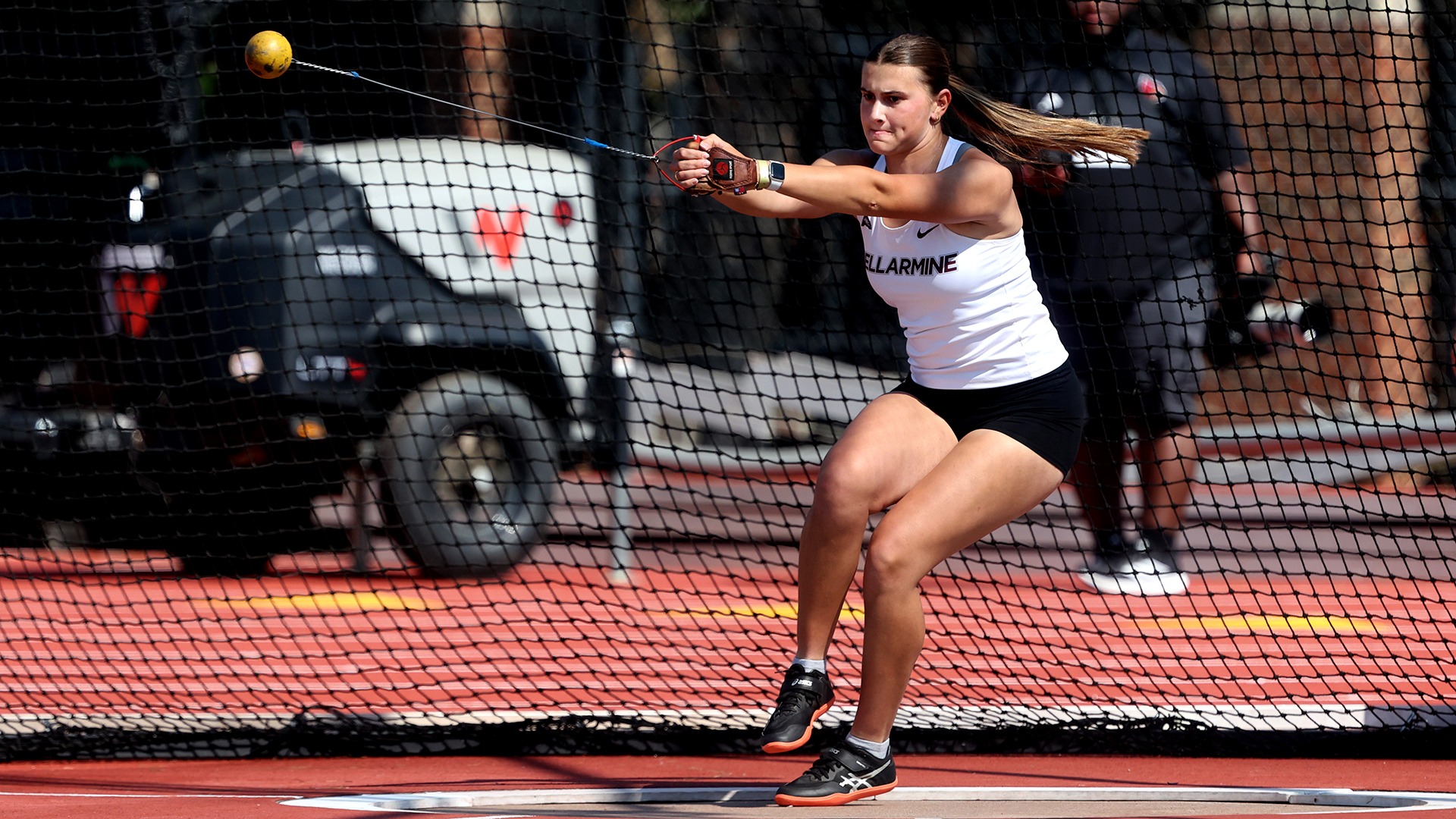 Caysie Brady competes in the hammer throw at the U of L meet.