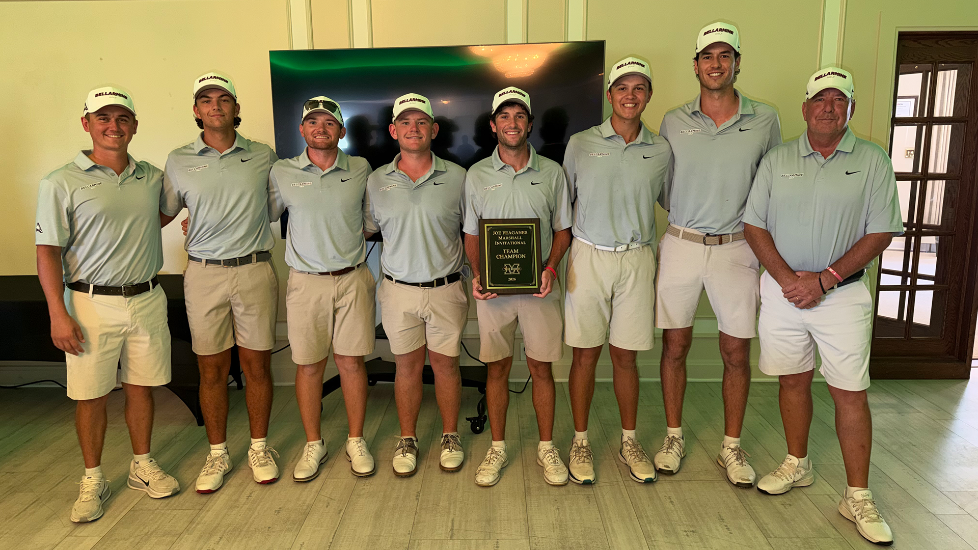 Men's golf holds the first place trophy after their win at the Joe Feaganes Invitational