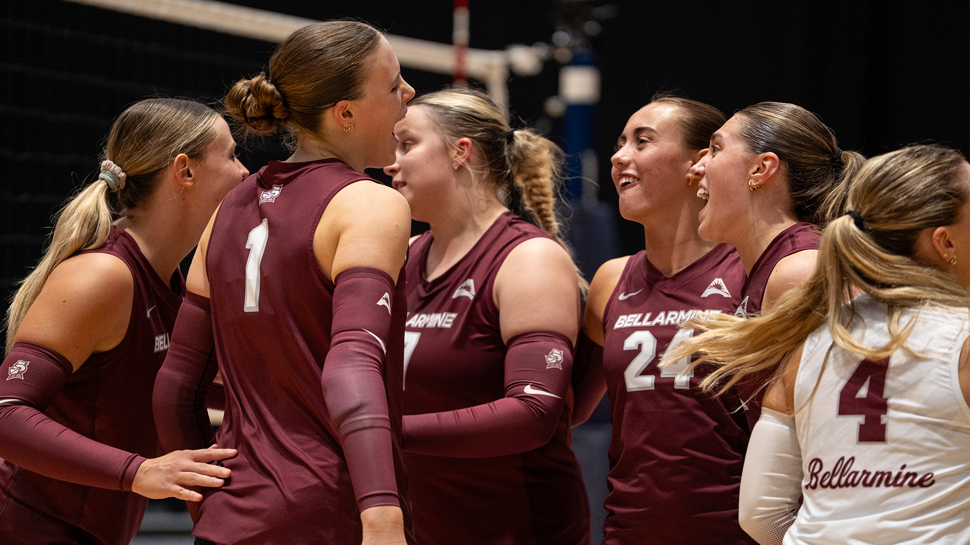 Volleyball team celebrates after scoring a point